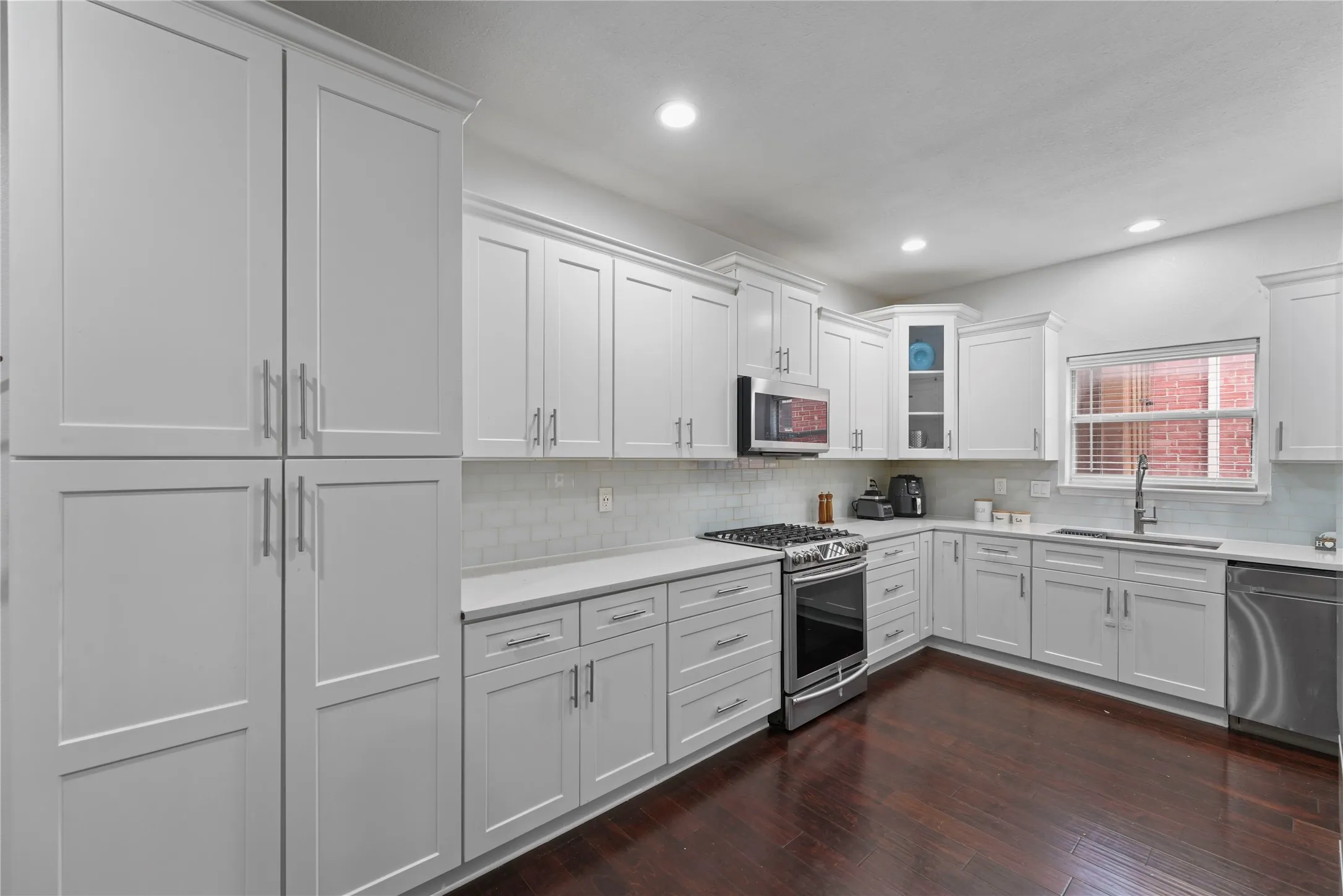 White shaker cabinetry with brushed nickel hardware