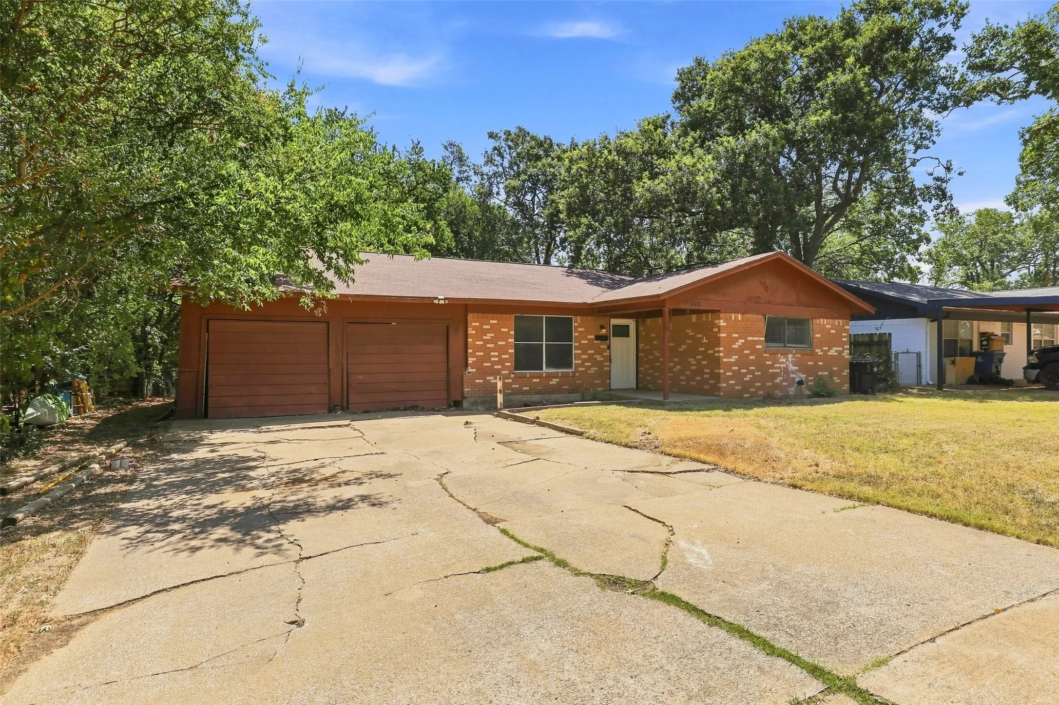 Brick facade with an attached two-car garage