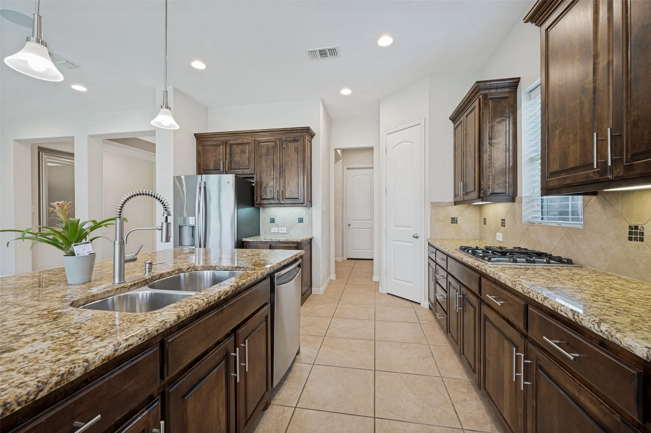 A walk-in pantry and abundant cabinet space provide exceptional storage for everyday living and entertaining.