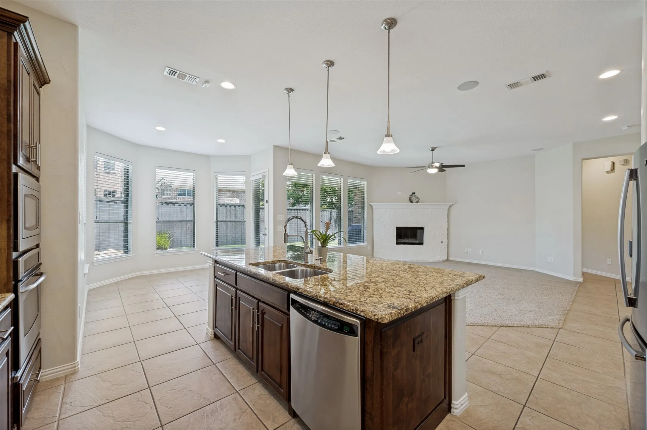 Open to the living and dining areas, this kitchen is perfect for everyday living and effortless entertaining.