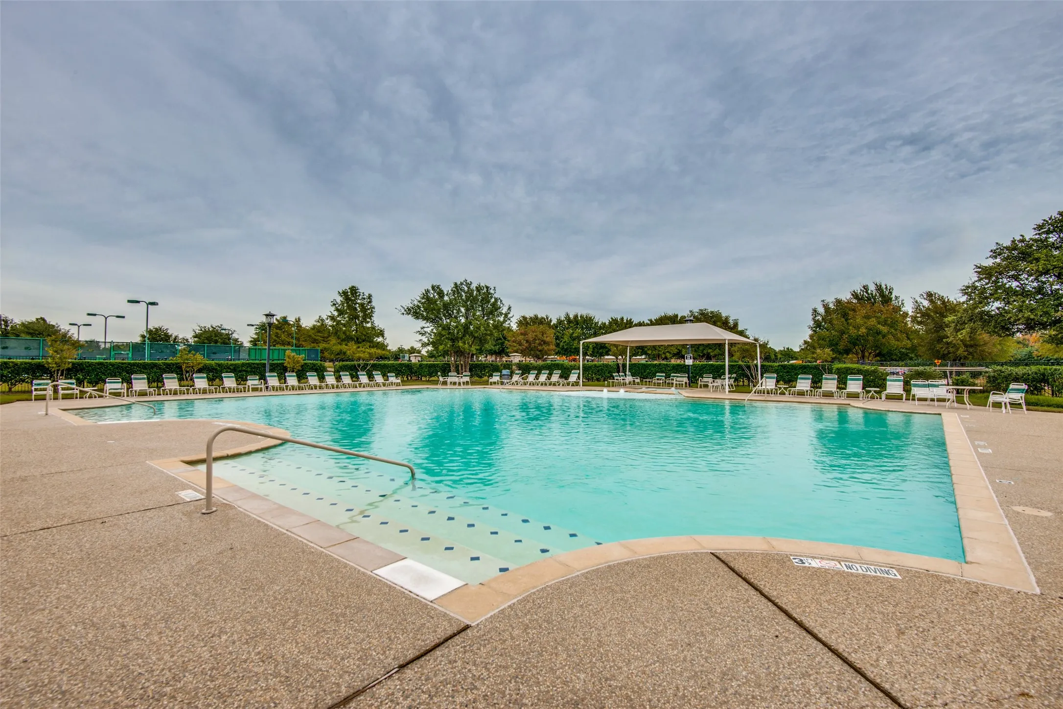 Relax and unwind at the neighborhood resort style pool, featuring ample lounge seating, a shaded pavilion, and plenty of space to soak up the Texas sunshine with family and friends.