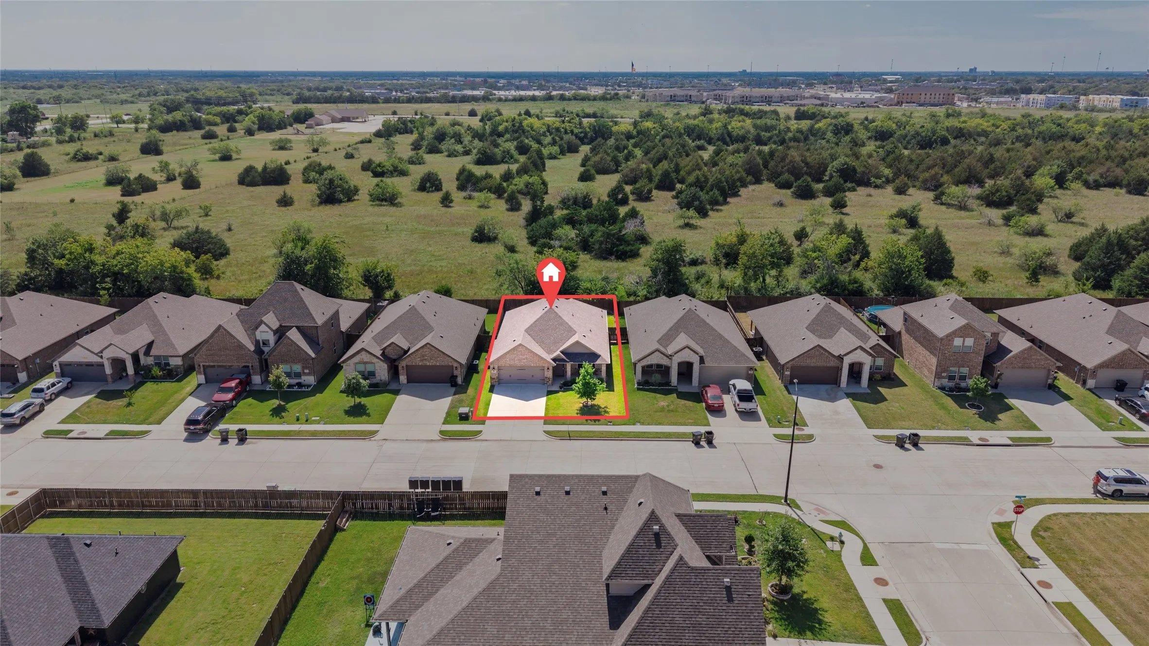 Aerial perspective showcasing a residential street with single-story homes