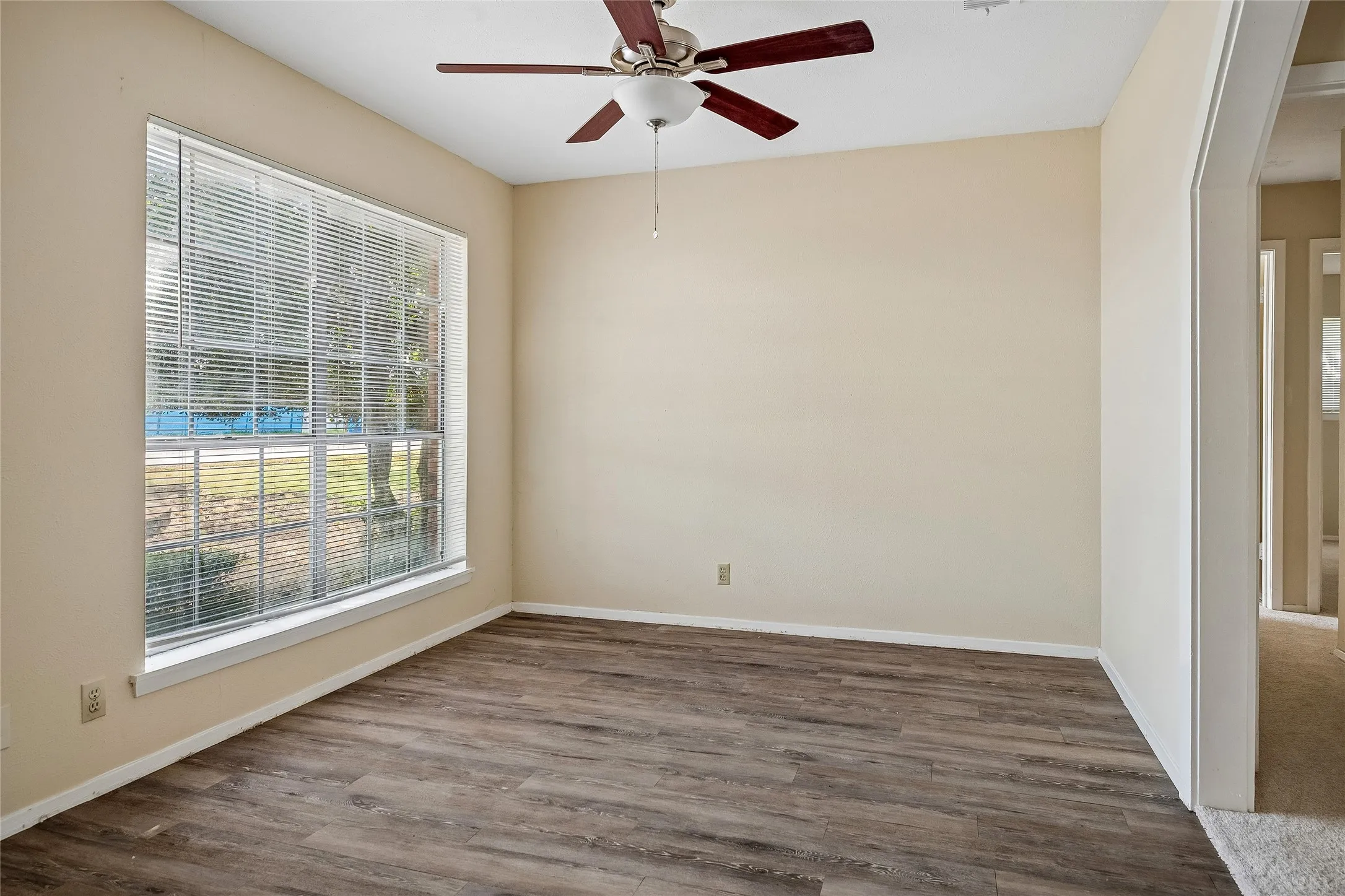 Living room or could be home office space with wood floors!