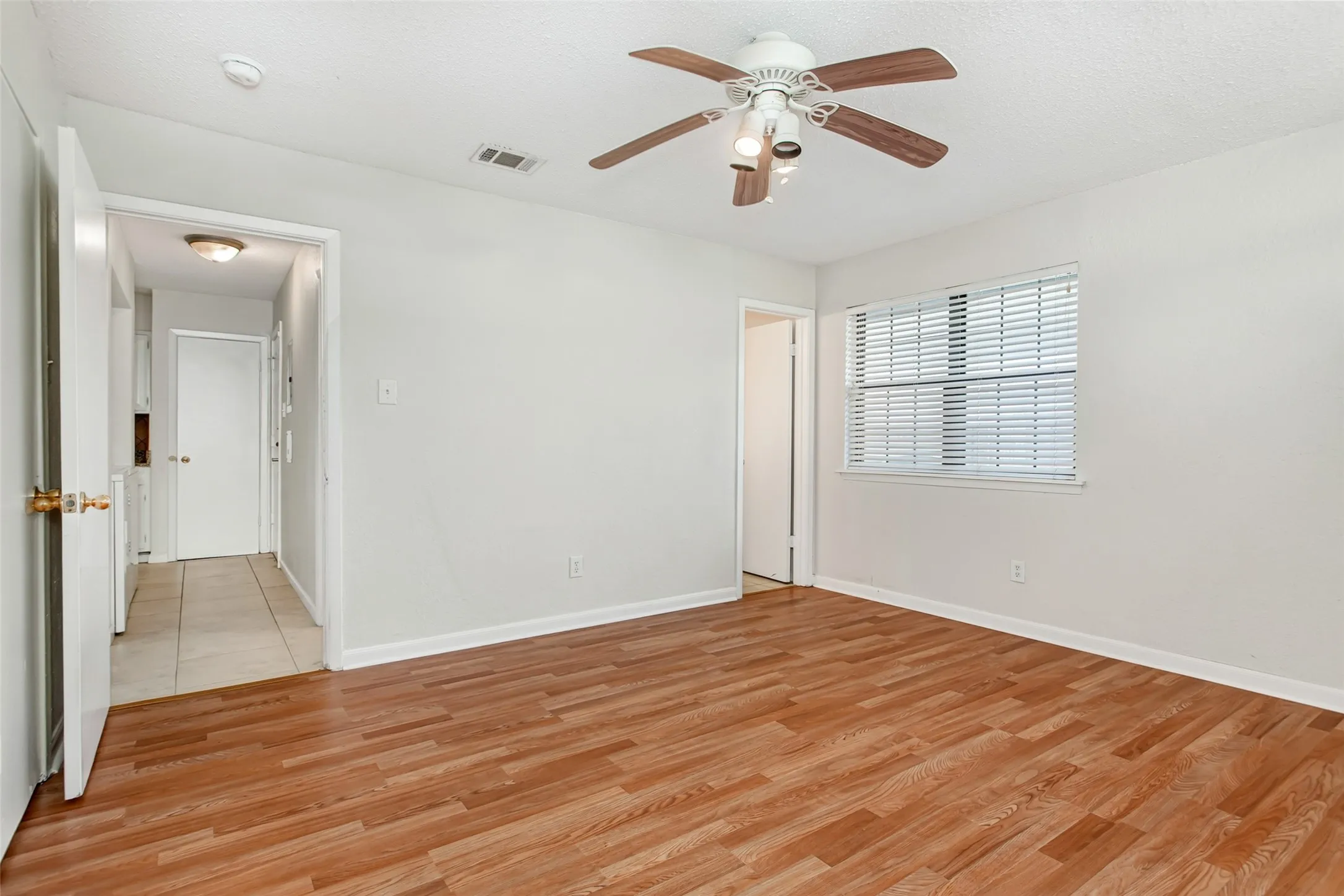 Spacious primary bedroom with in-suite bath and abundant natural light.