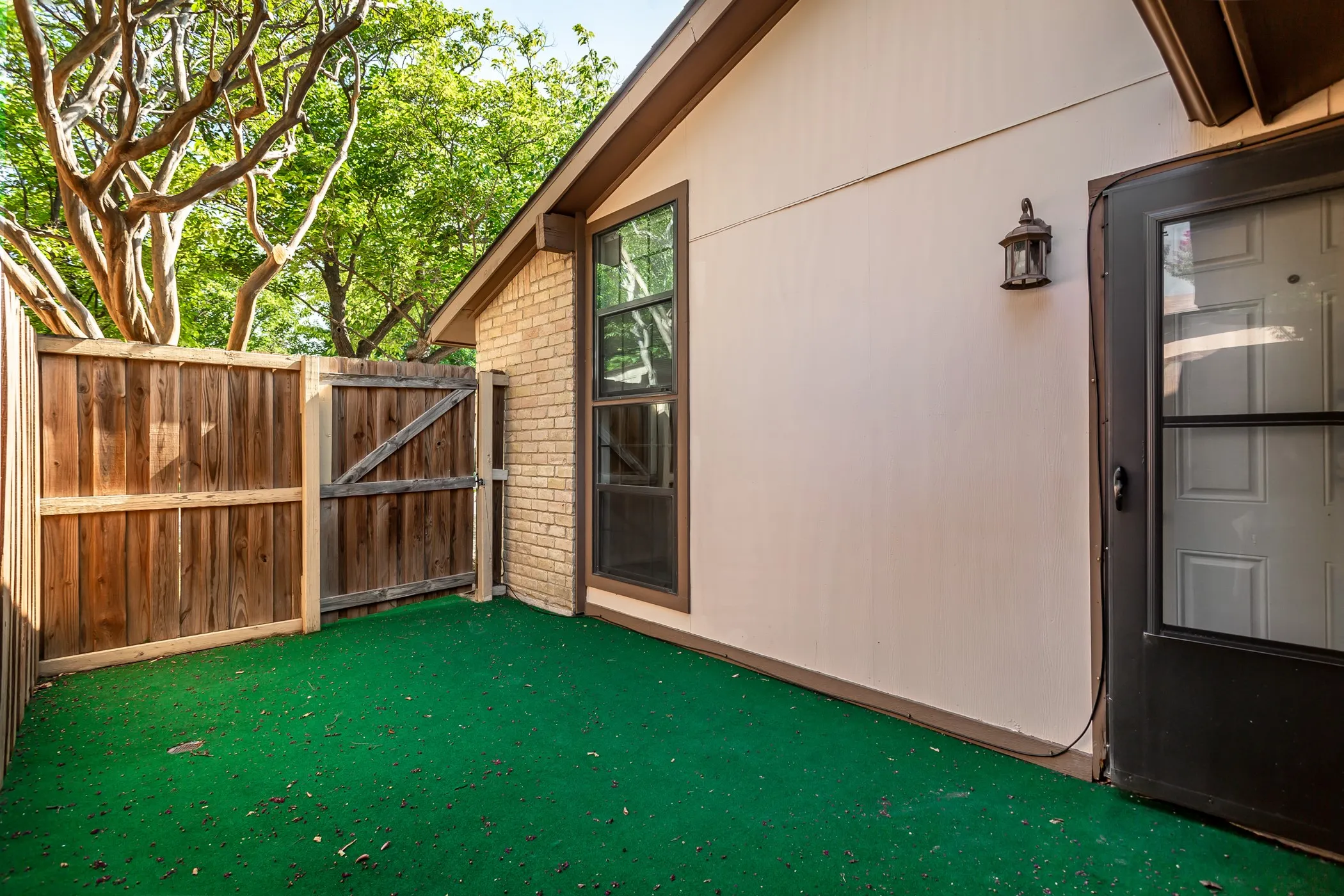  Courtyard entry offers low-maintenance turf and space for relaxation.