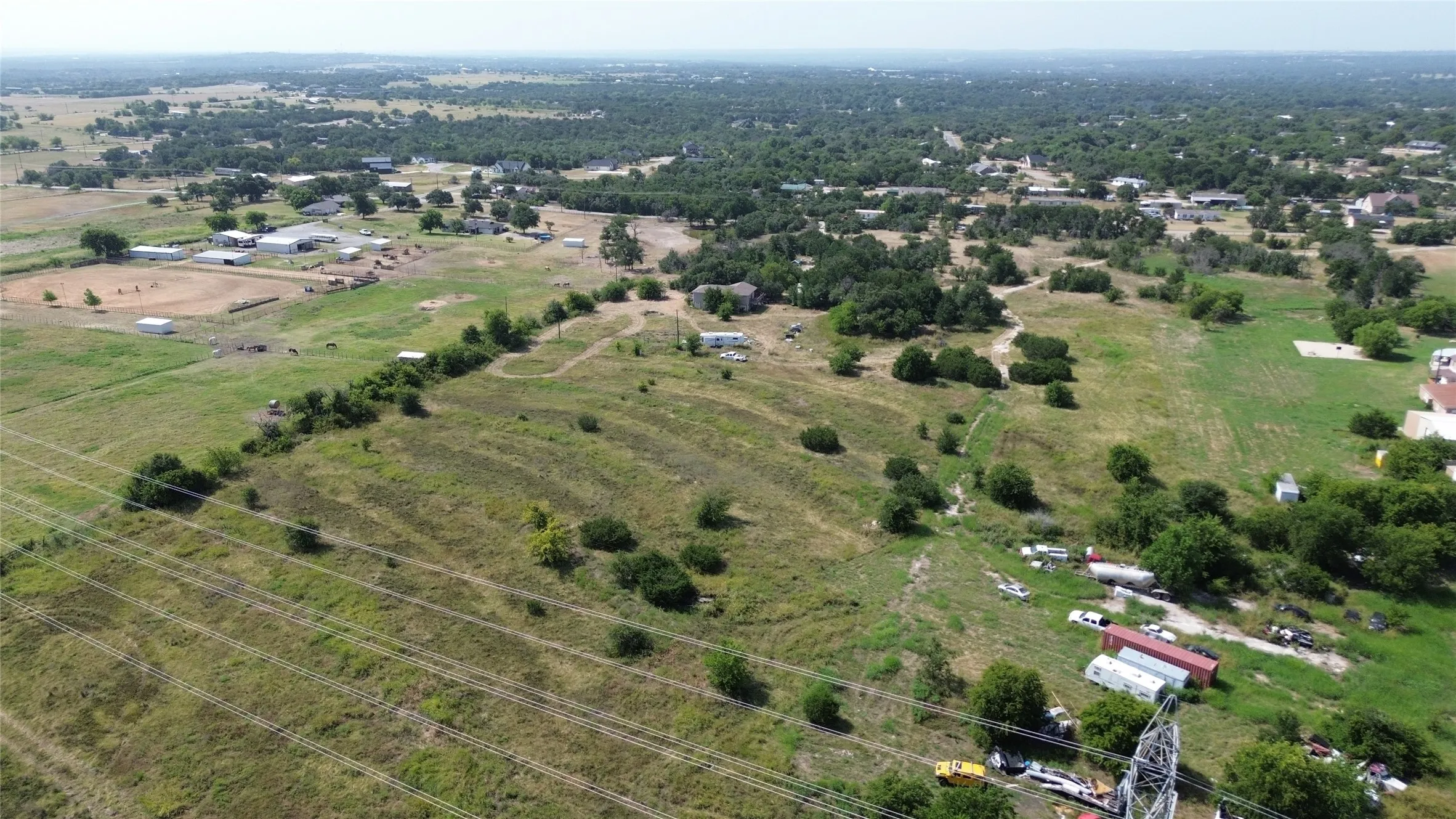 Expansive acreage featuring established trees and varied topography