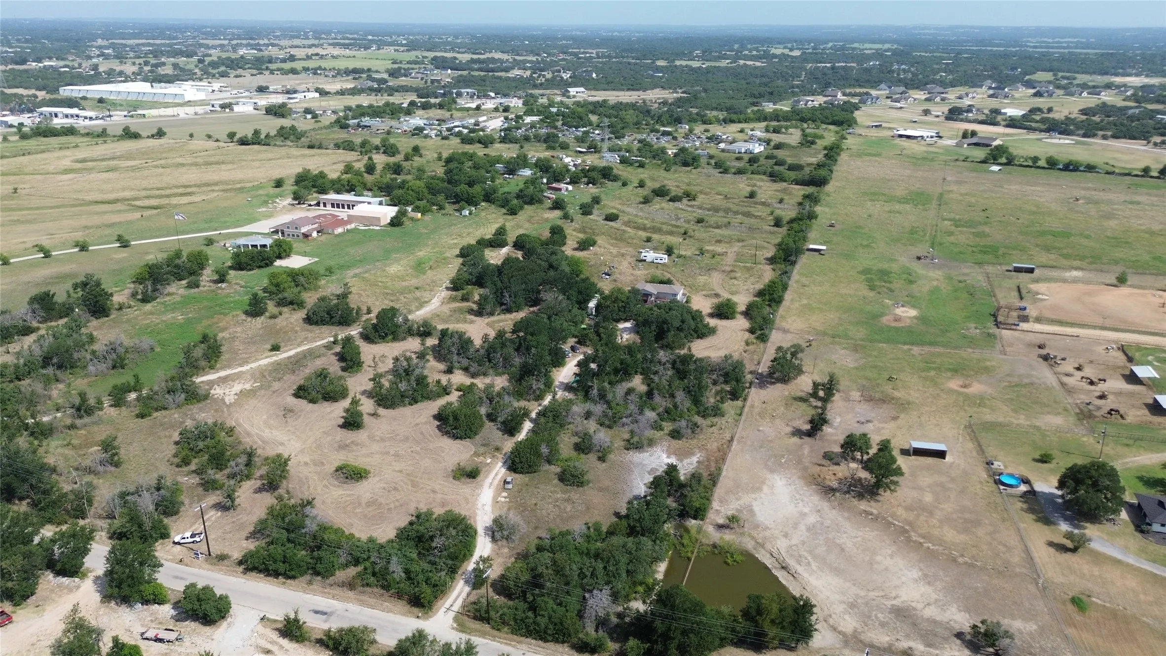 Expansive land parcel featuring diverse topography and natural vegetation