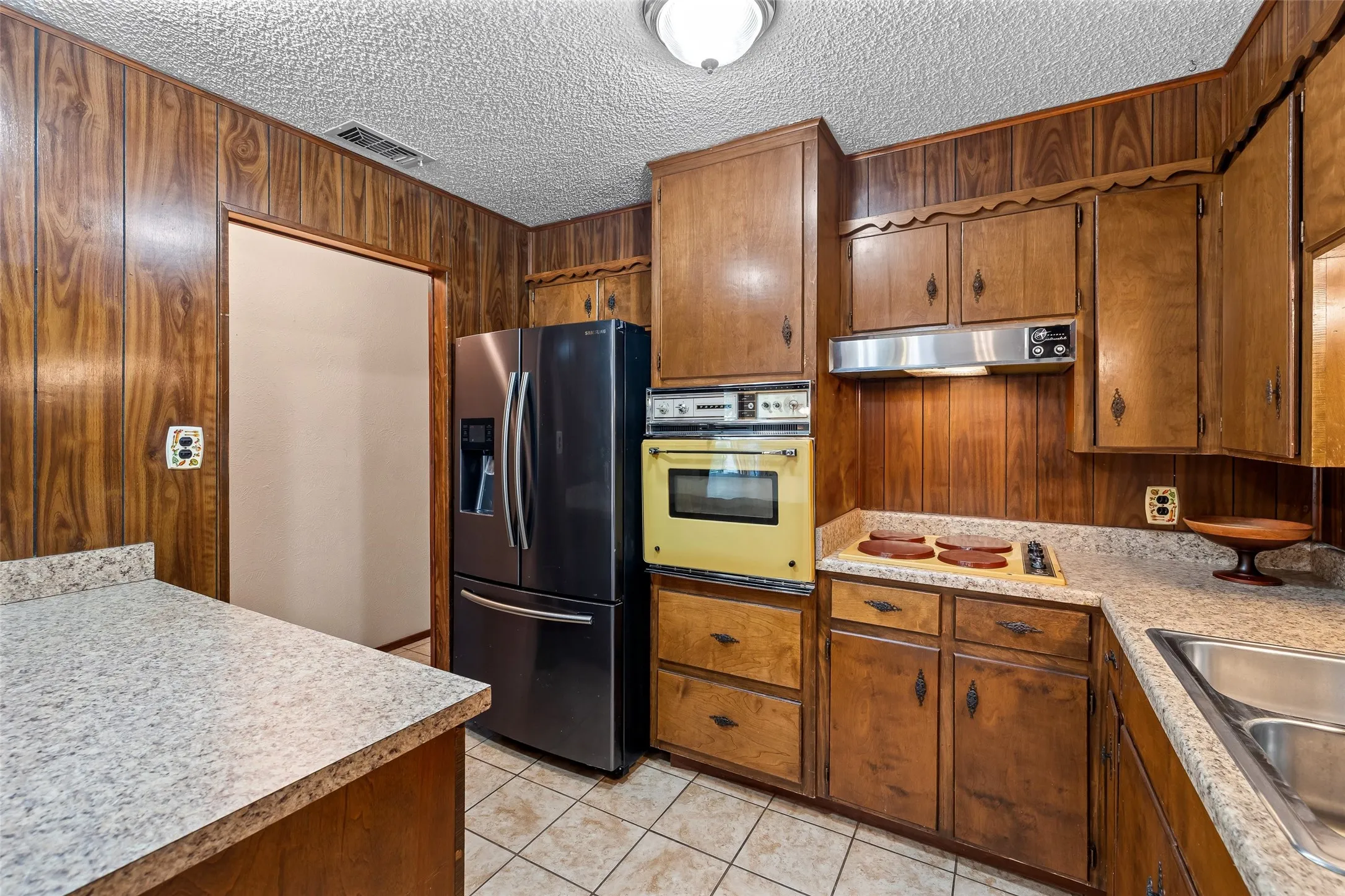 Spacious kitchen with timeless wood cabinets