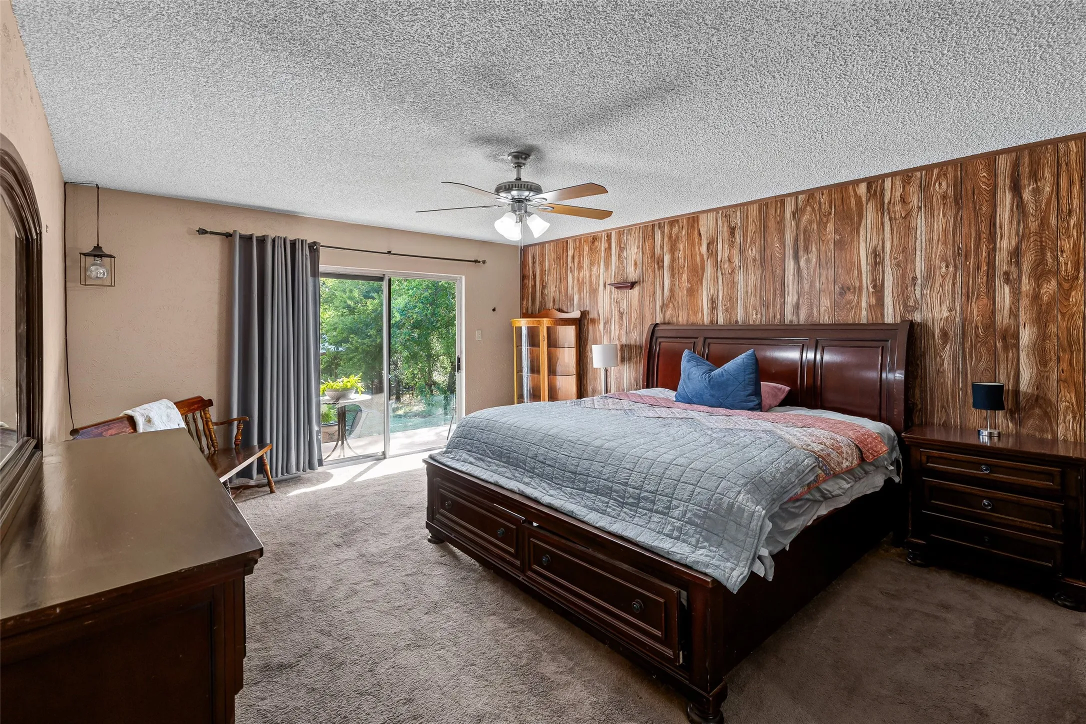 Large primary with natural light and private patio