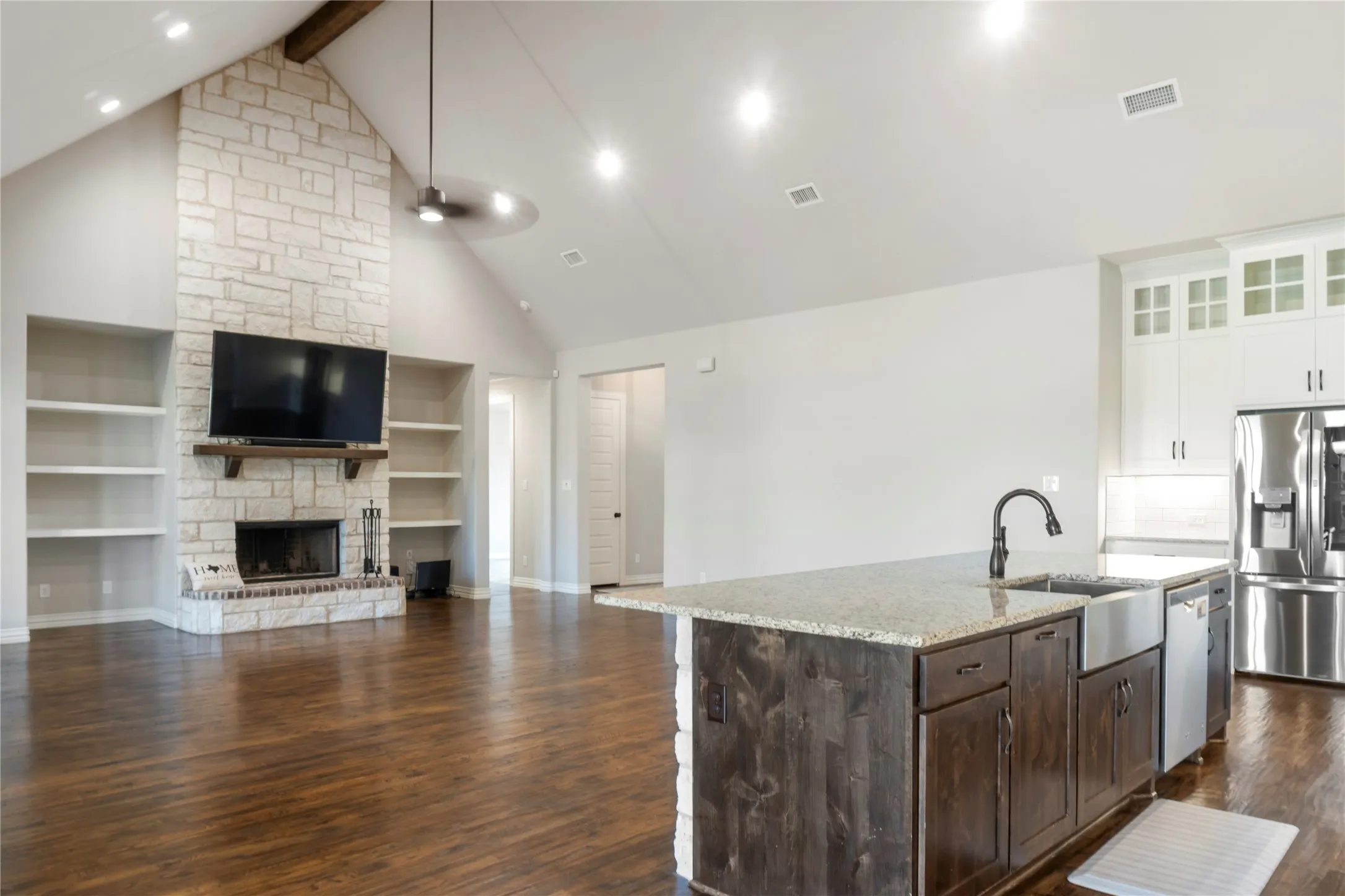 Living room w/ stone fireplace
