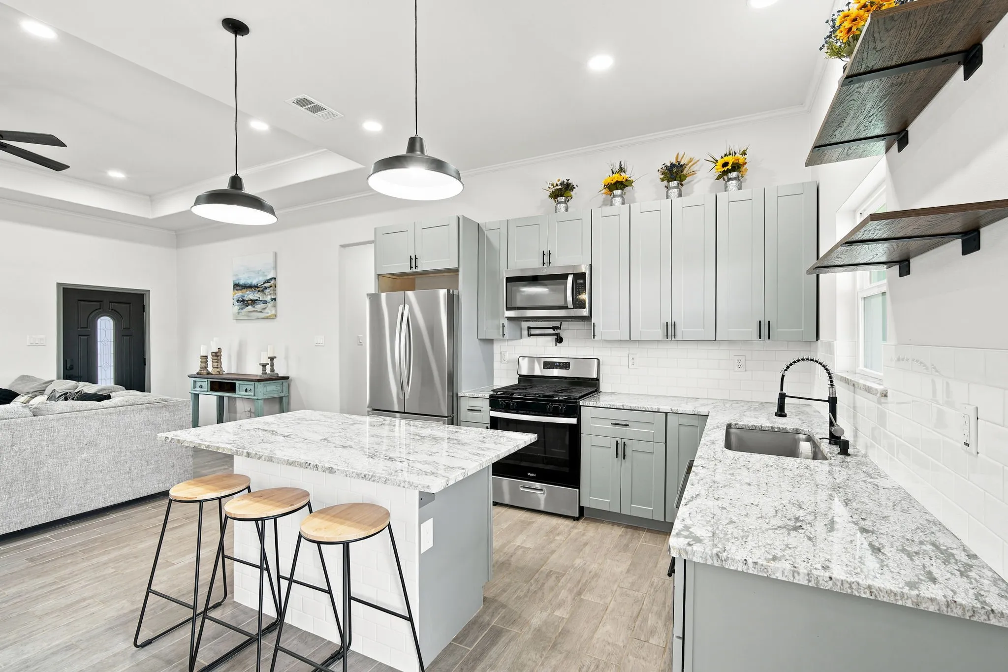 Gorgeous kitchen featuring a large island, abundant cabinetry, and plenty of space for cooking, gathering, and entertaining.