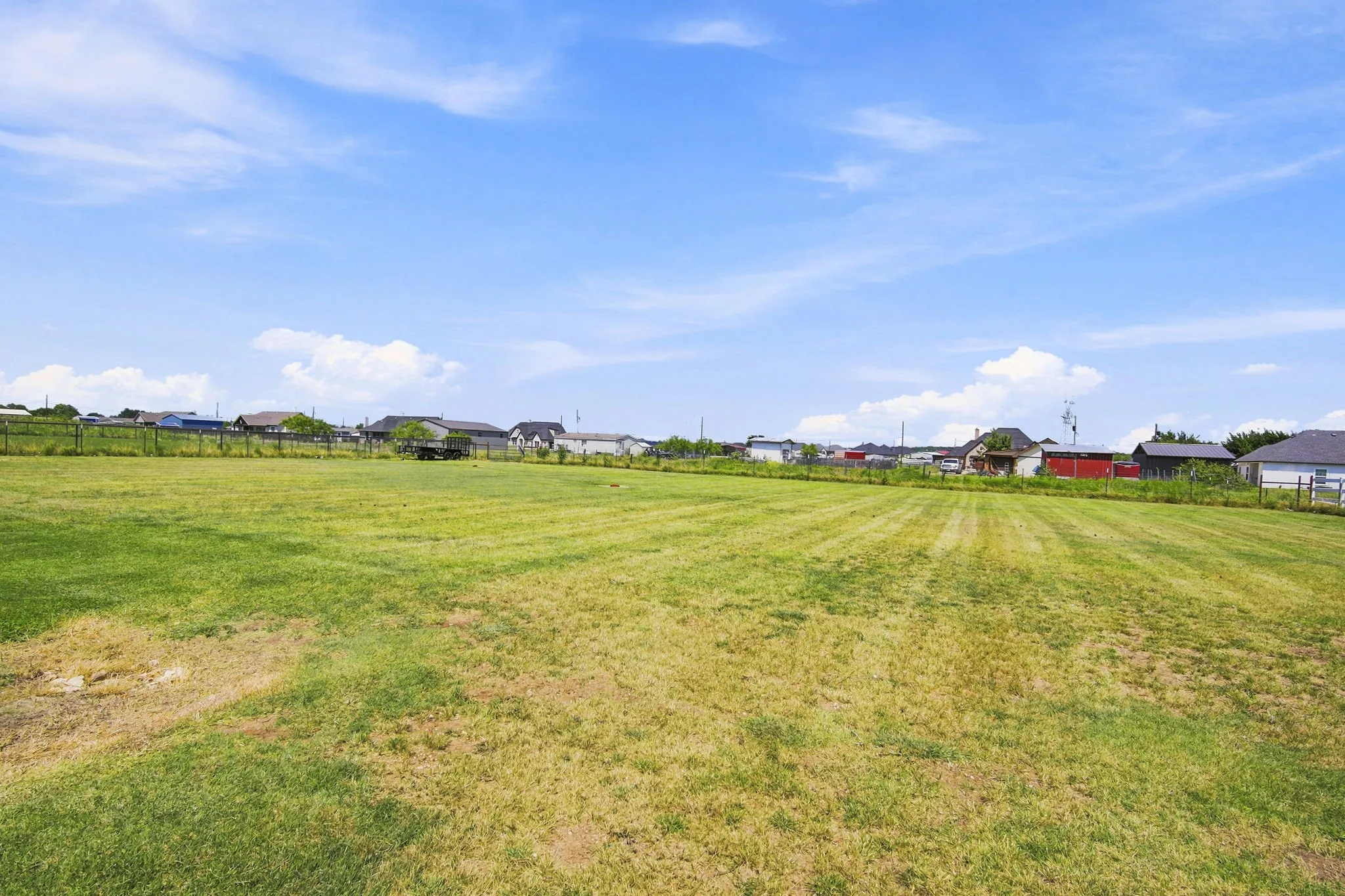 Beautiful rear exterior with a spacious yard, ideal for outdoor gatherings or quiet relaxation