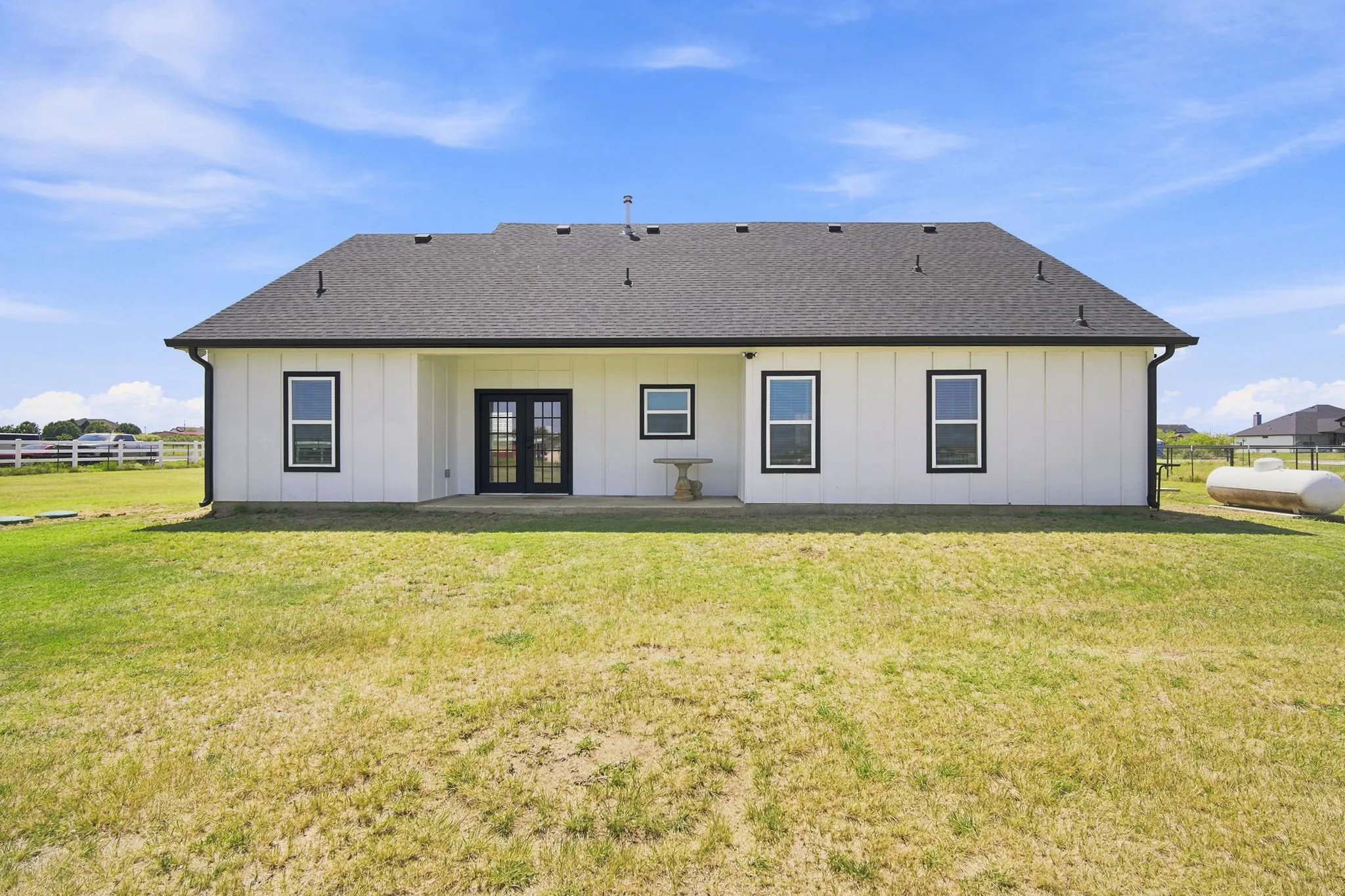 Beautiful rear exterior with a spacious yard, ideal for outdoor gatherings or quiet relaxation.