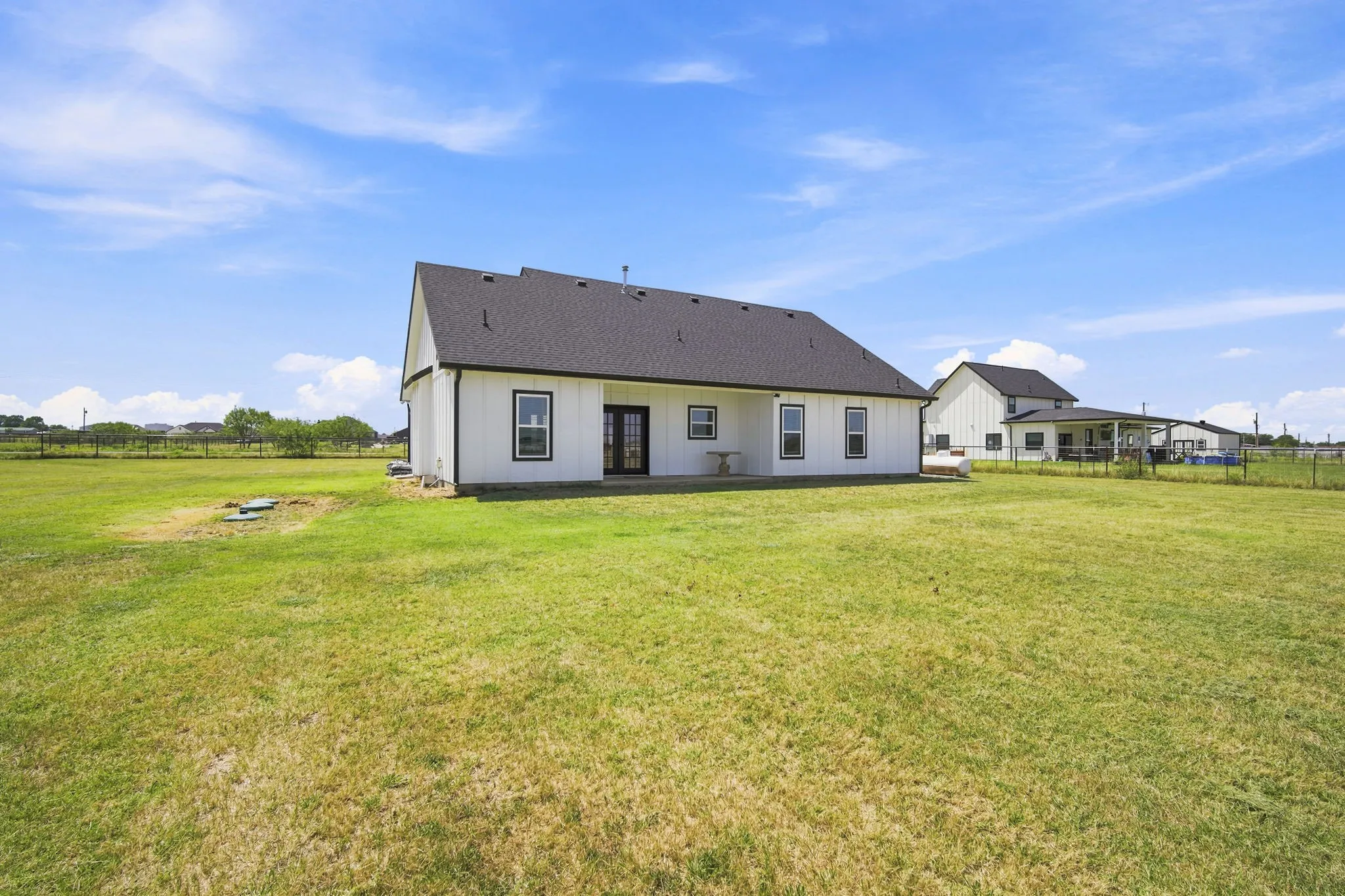 Beautiful rear exterior with a spacious yard, ideal for outdoor gatherings or quiet relaxation