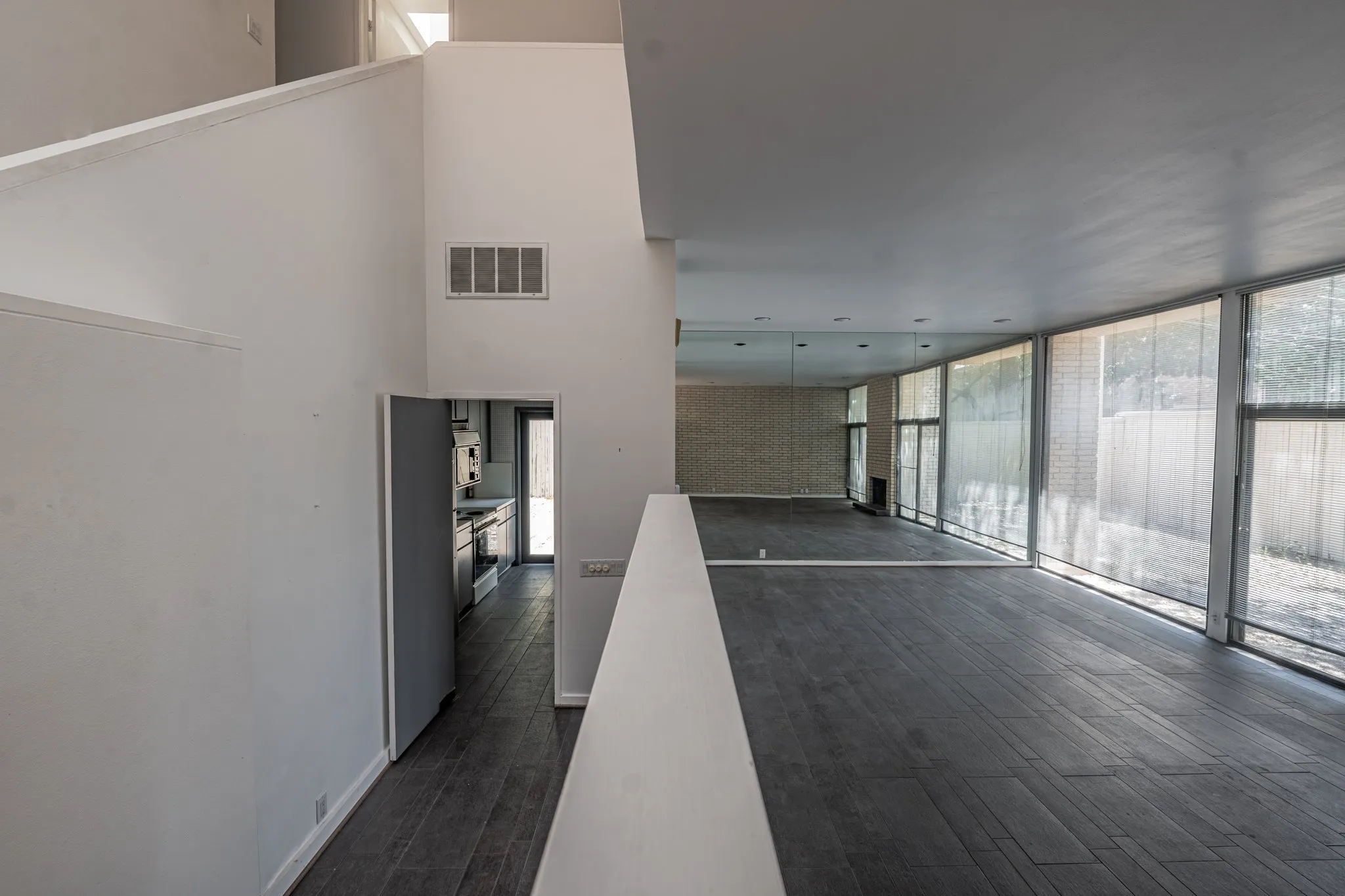 Living area with wonderful windows and entrance to the kitchen