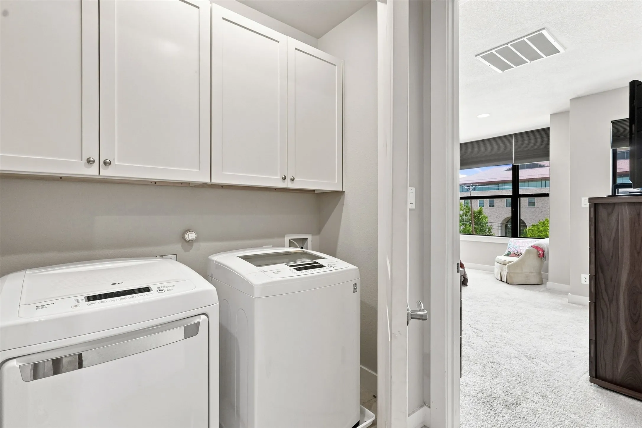 Third floor laundry room on the same level as the primary and second bedroom.