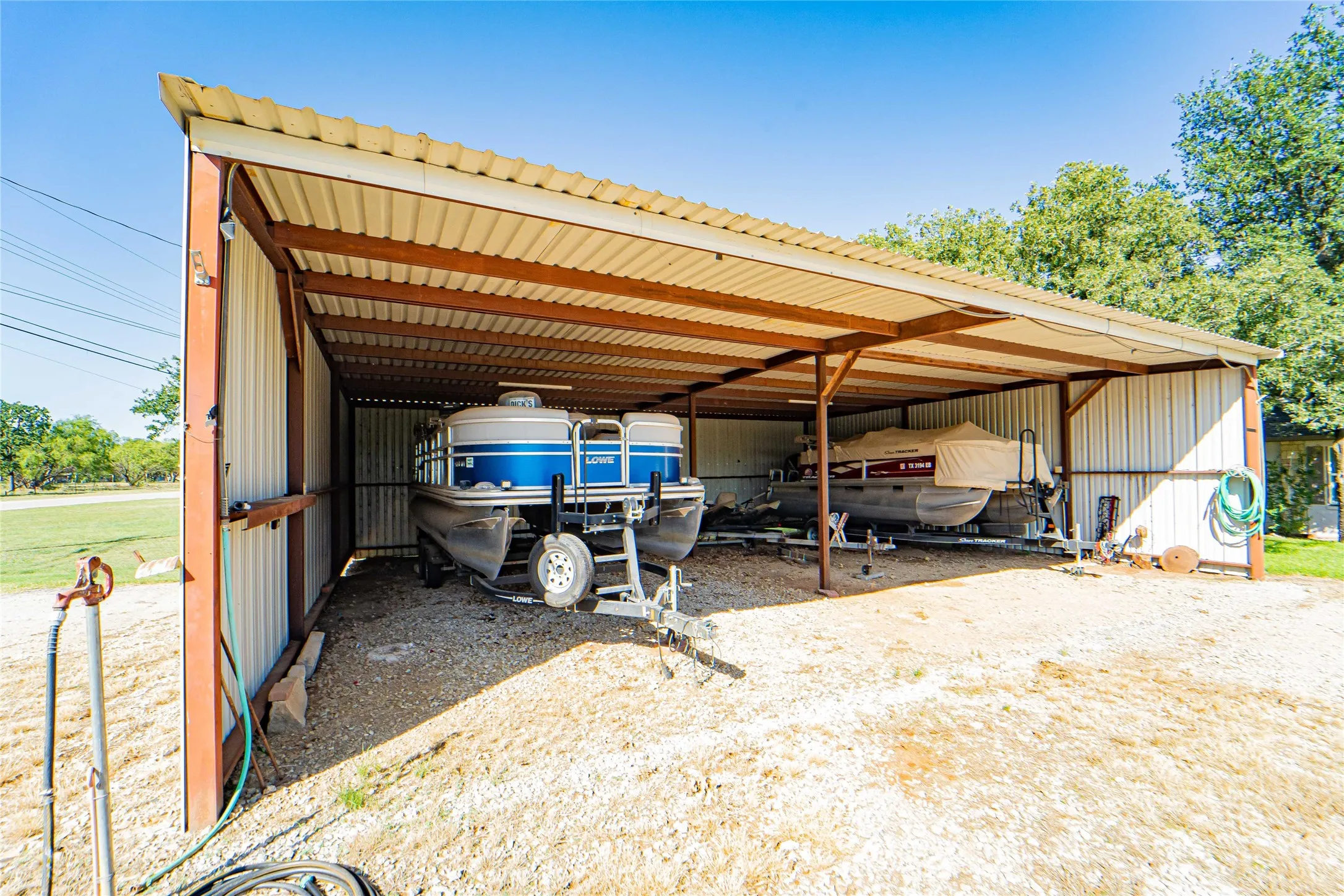 30x40 Carport provides coverage for additional vehicles, boats and lake toys!