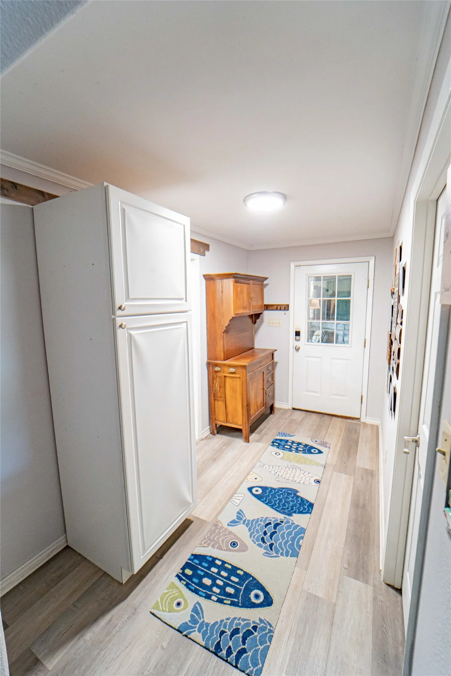 Hallway leading to outdoor patio and game room-