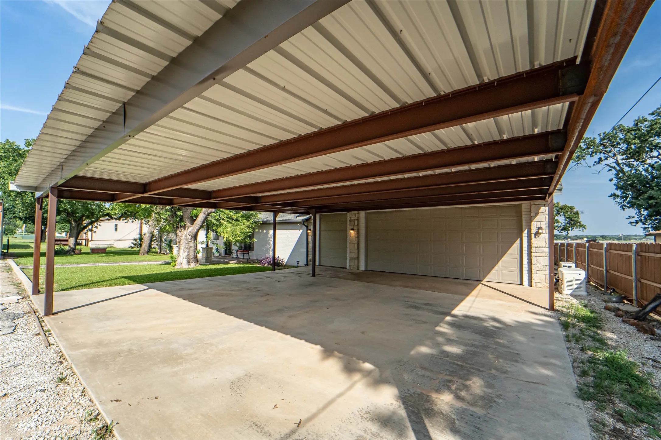 33x33 Carport in addition to 2.5 enclosed and attached garage, providing additional covered parking for you and guests-