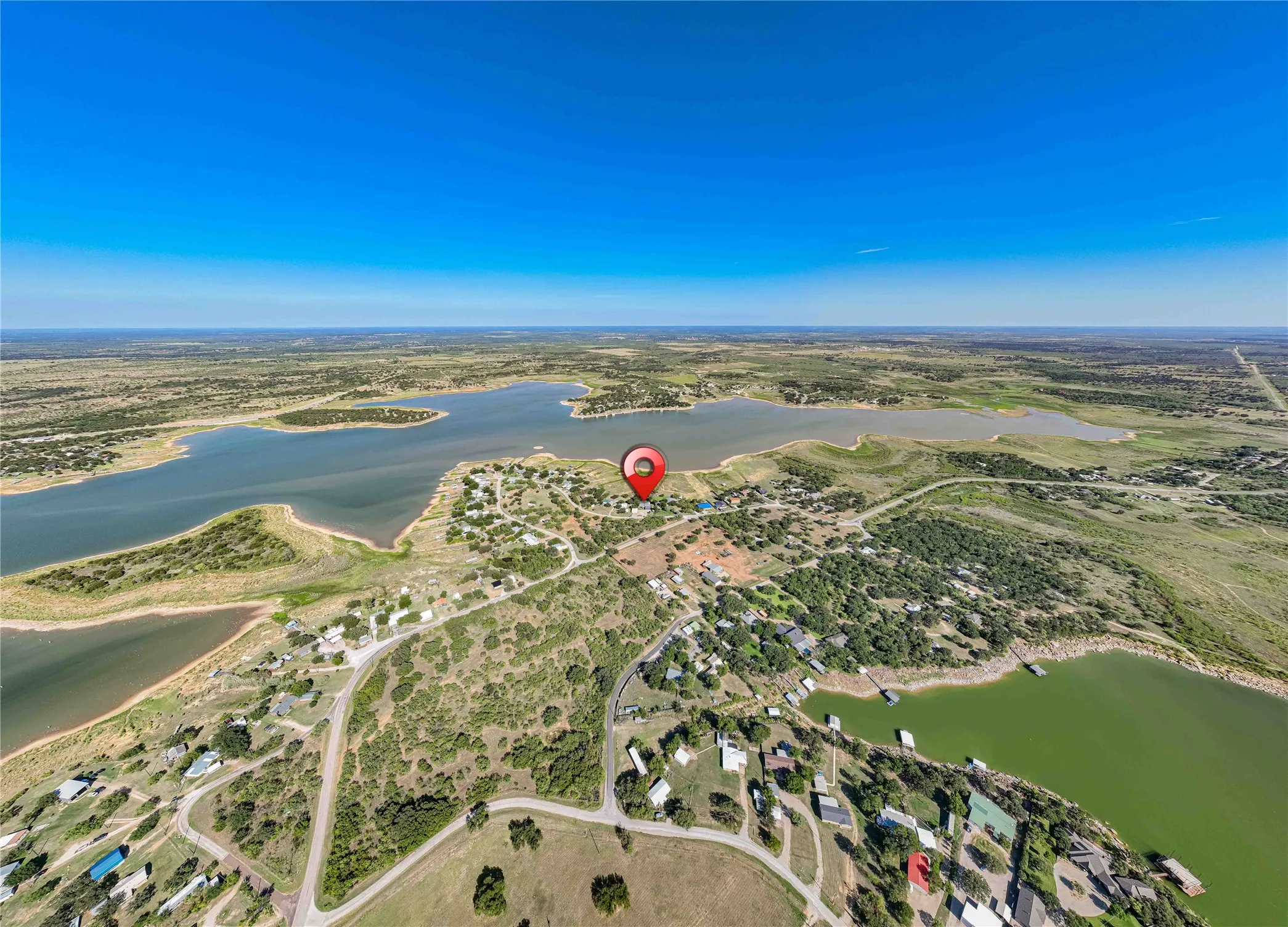 Expansive aerial perspective showcasing a significant body of water with varied shoreline development