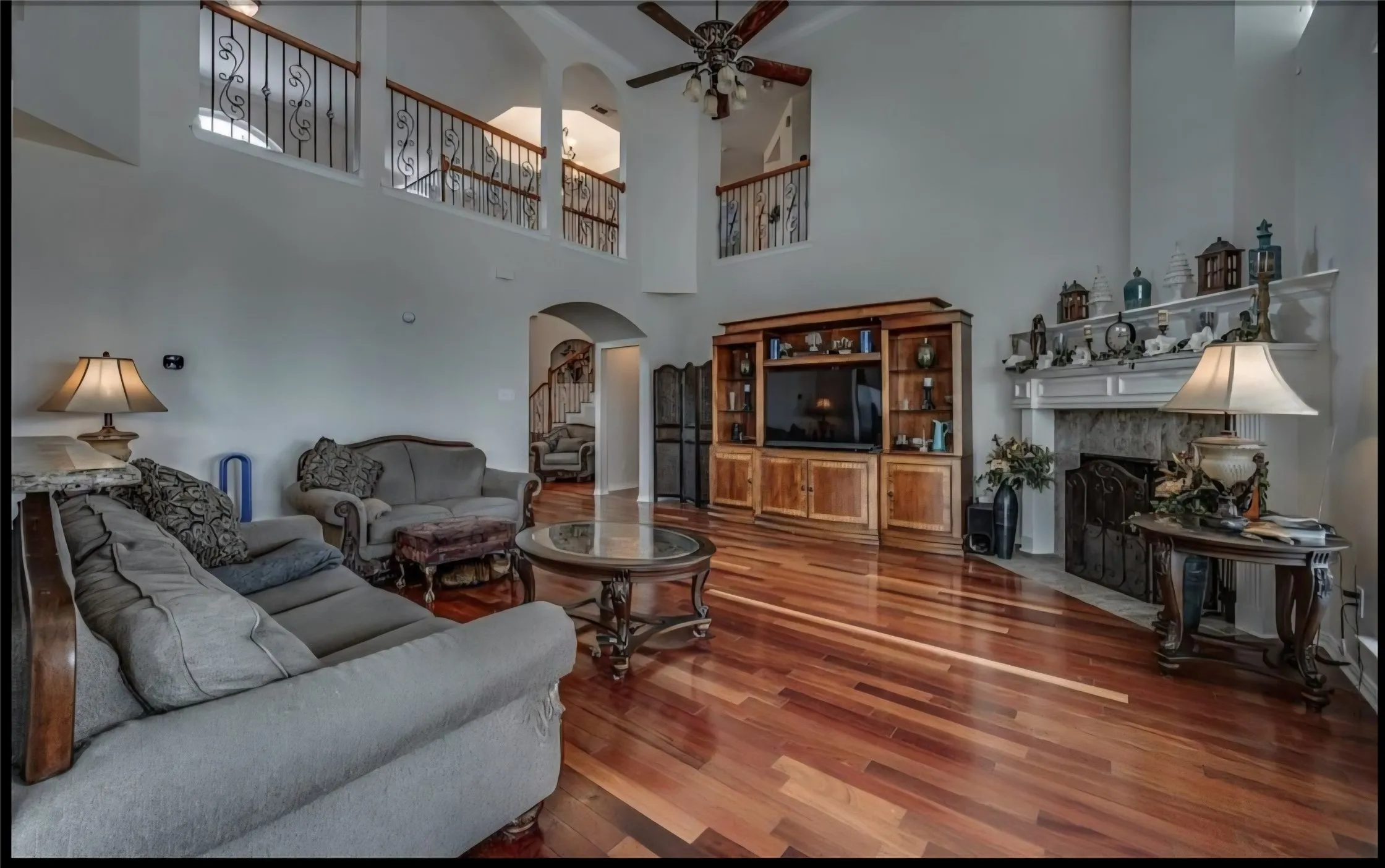LIVING ROOM BOASTS WOOD BURNING FIREPLACE