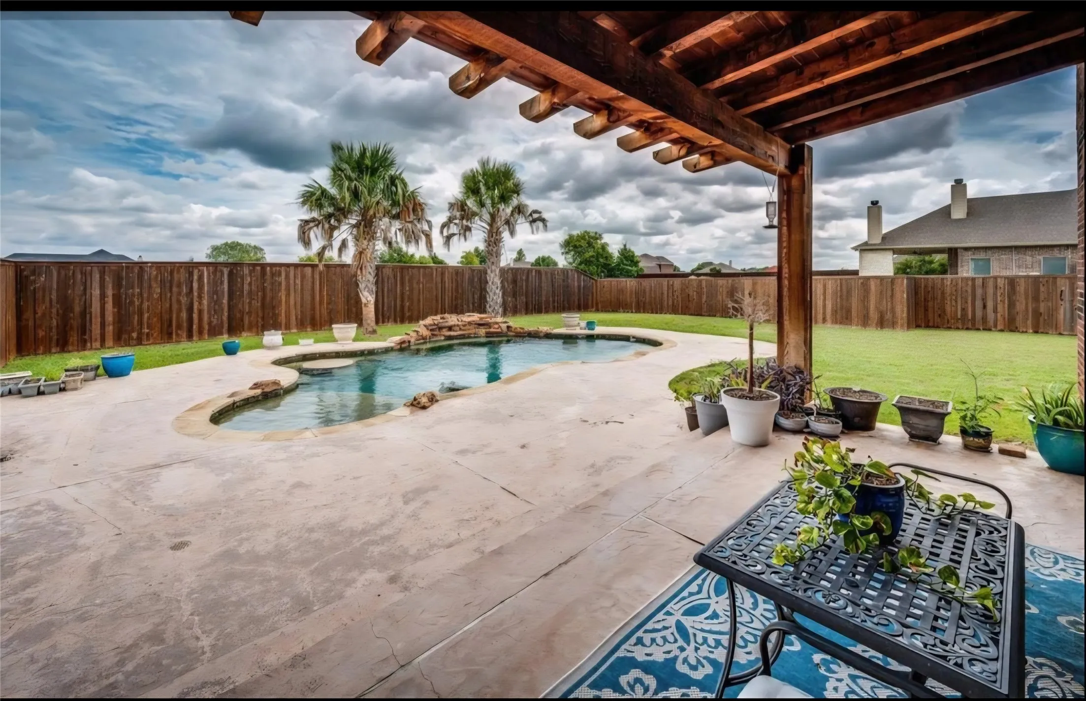 POOL IS A BACKYARD OASIS