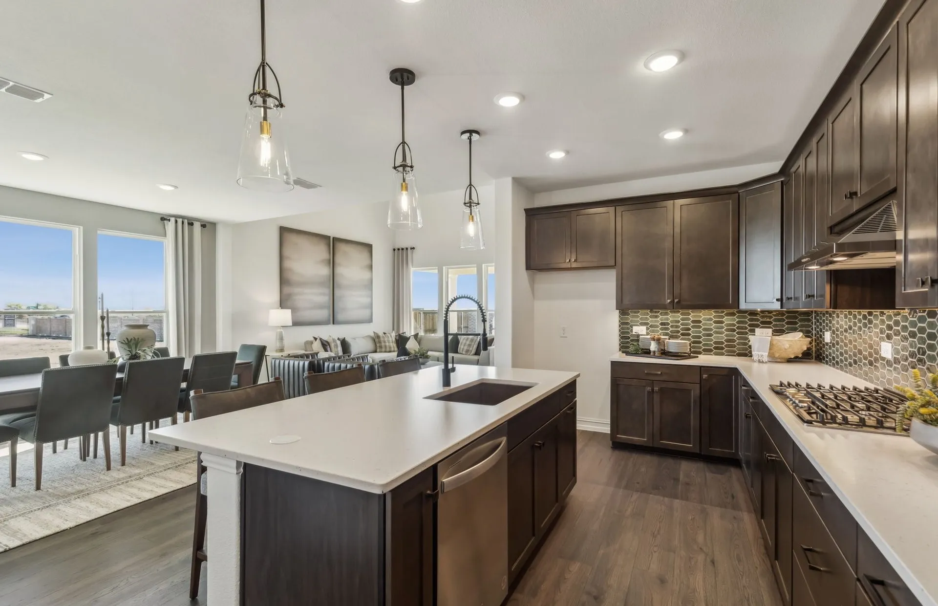 *Model Representation - Large island overlooking gathering room and dining areas