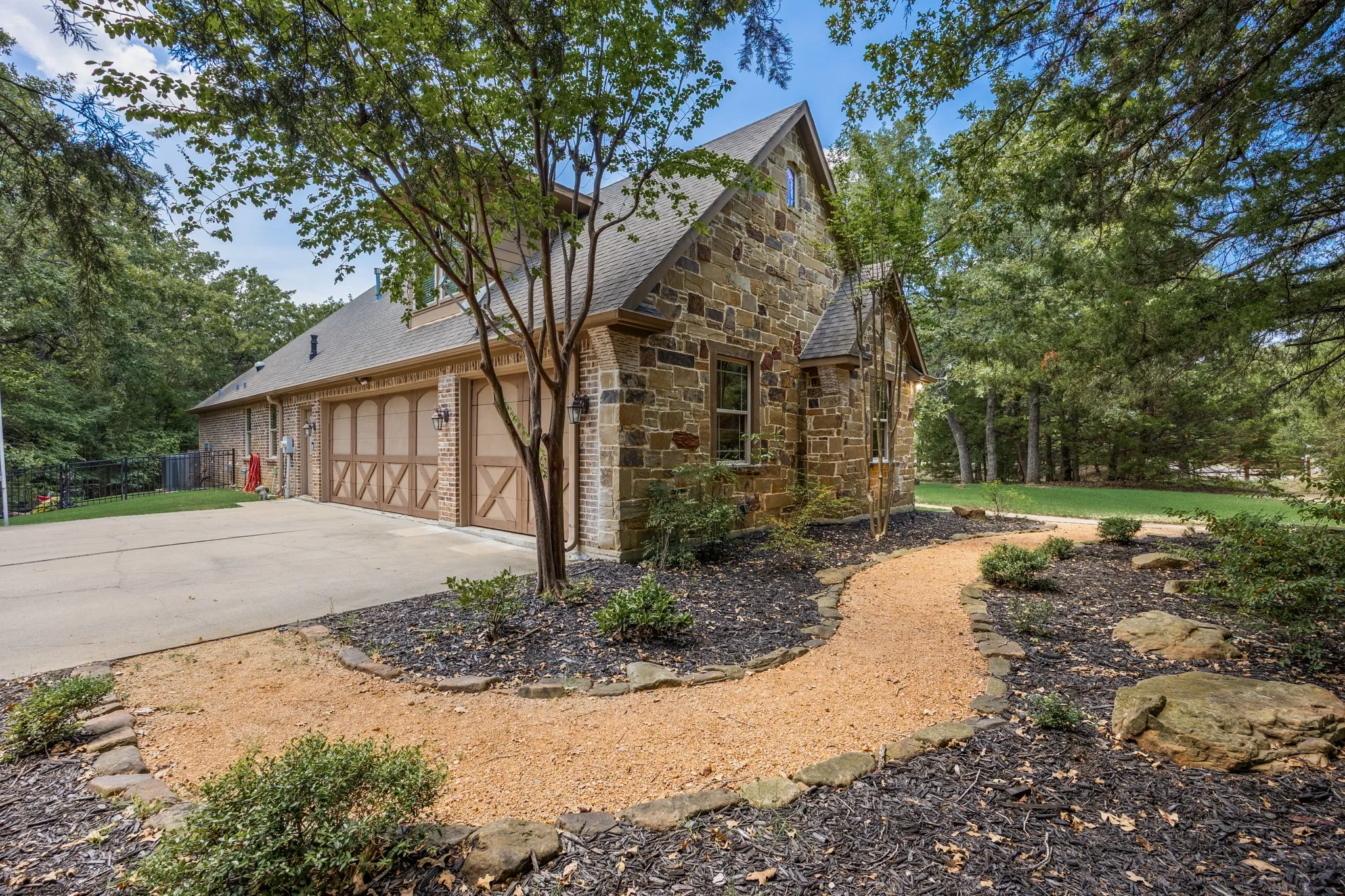 3 car garage along with crushed granite walk to front door