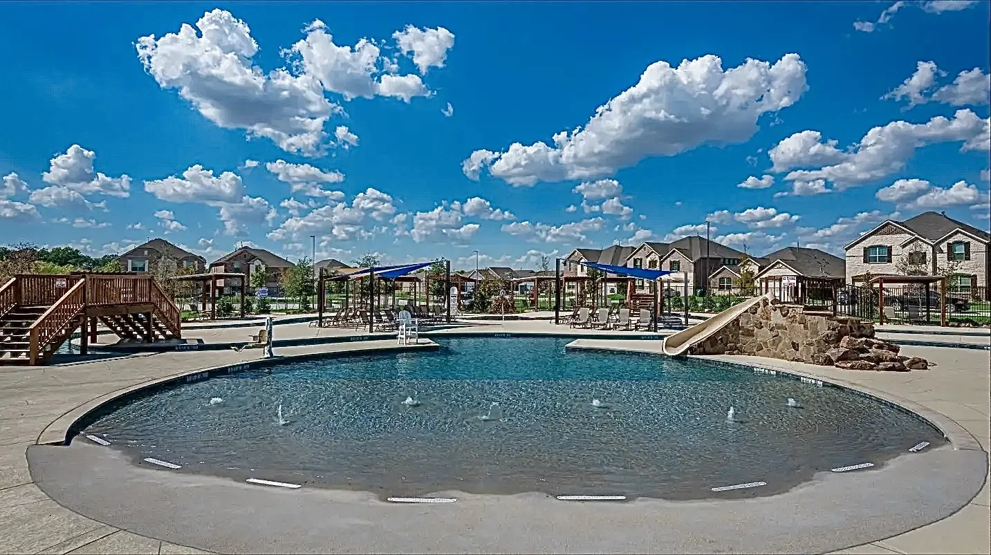 Community pool with a residential view, stairs, and a patio