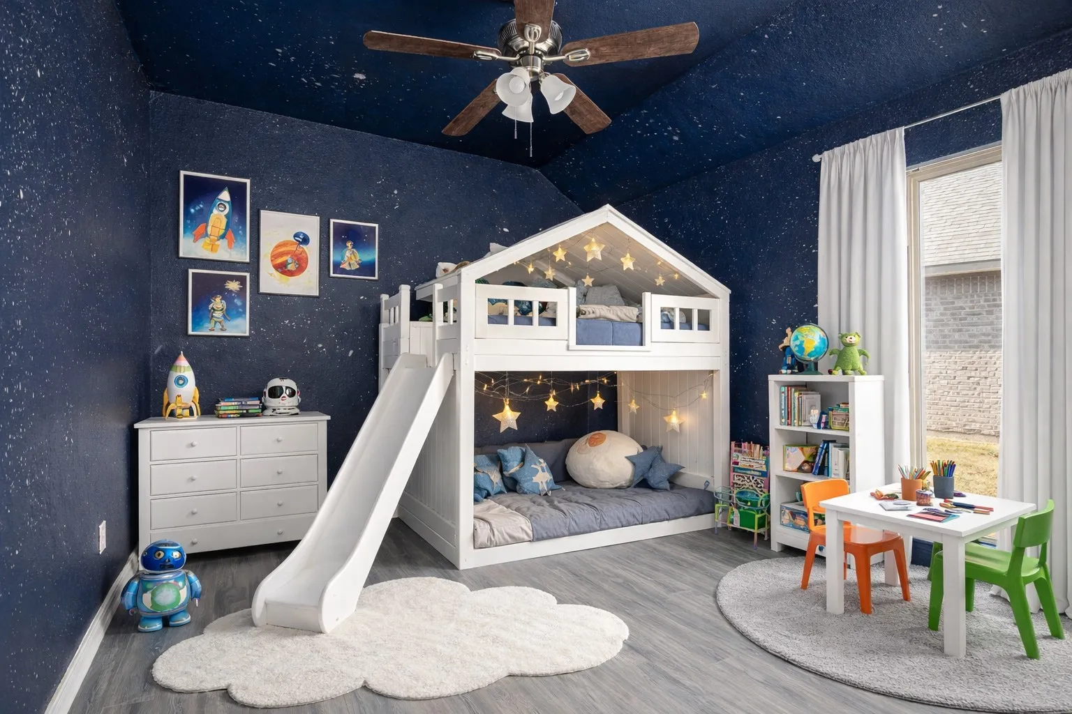 Bedroom with wood finished floors, a ceiling fan, and lofted ceiling