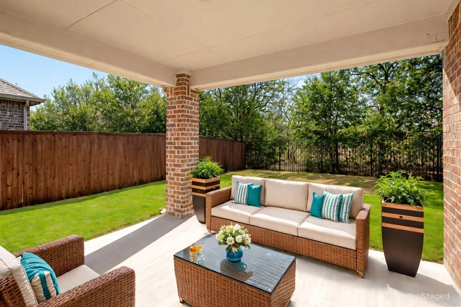 Fenced backyard with a patio and an outdoor lounge area