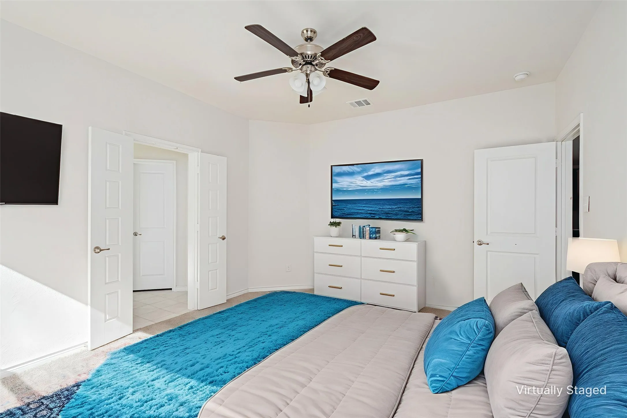 Bedroom with a ceiling fan and baseboards