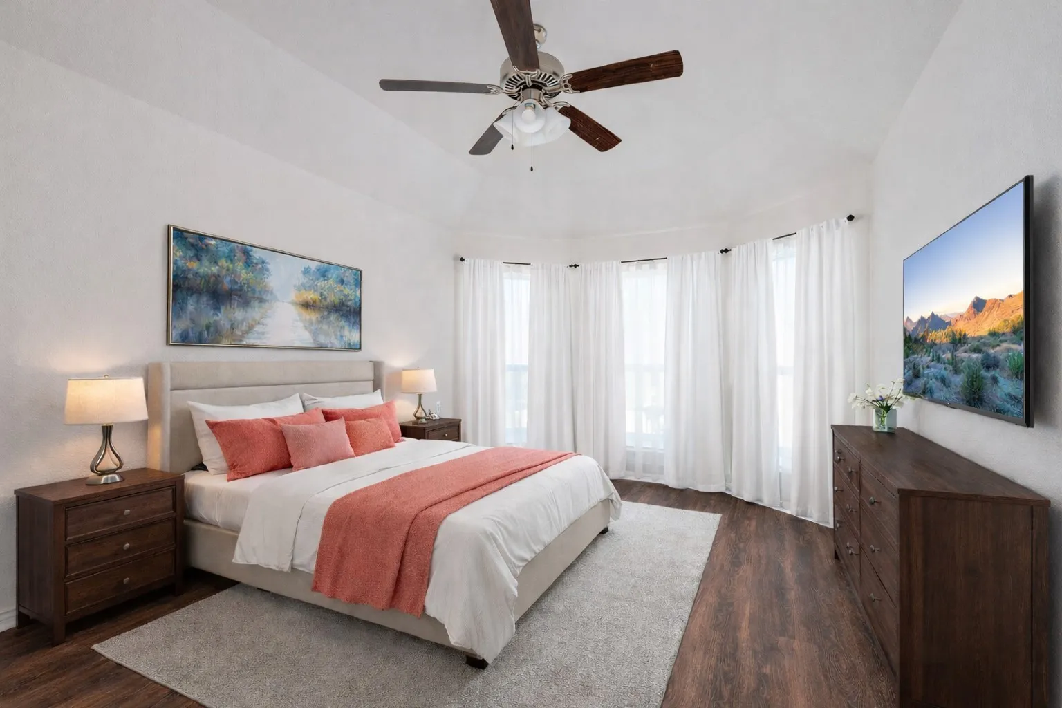 Bedroom with dark wood finished floors, ceiling fan, and vaulted ceiling
