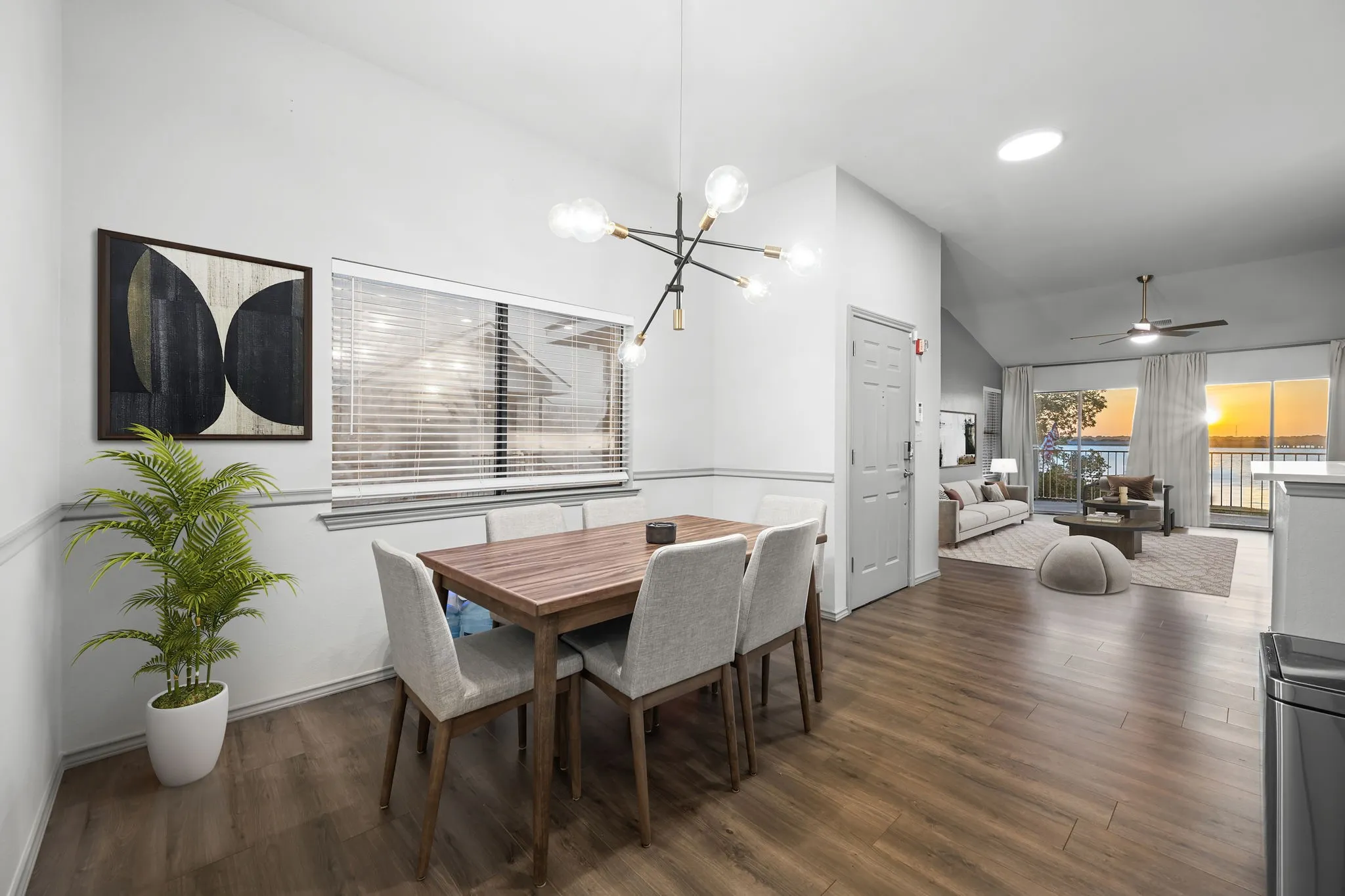 Virtually staged open-concept living space featuring a dining area