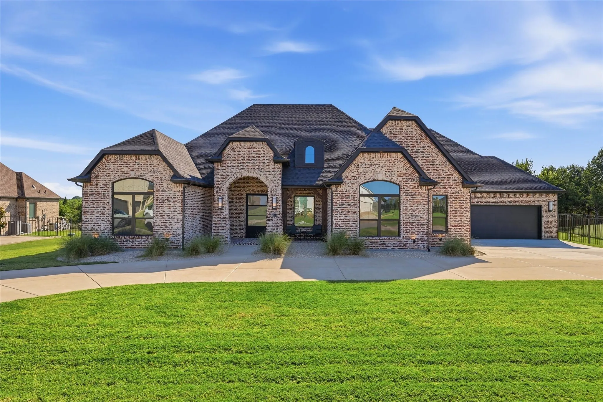 Beautiful wifi controlled exterior up lighting on this 2024 Partners in Building Custom home.