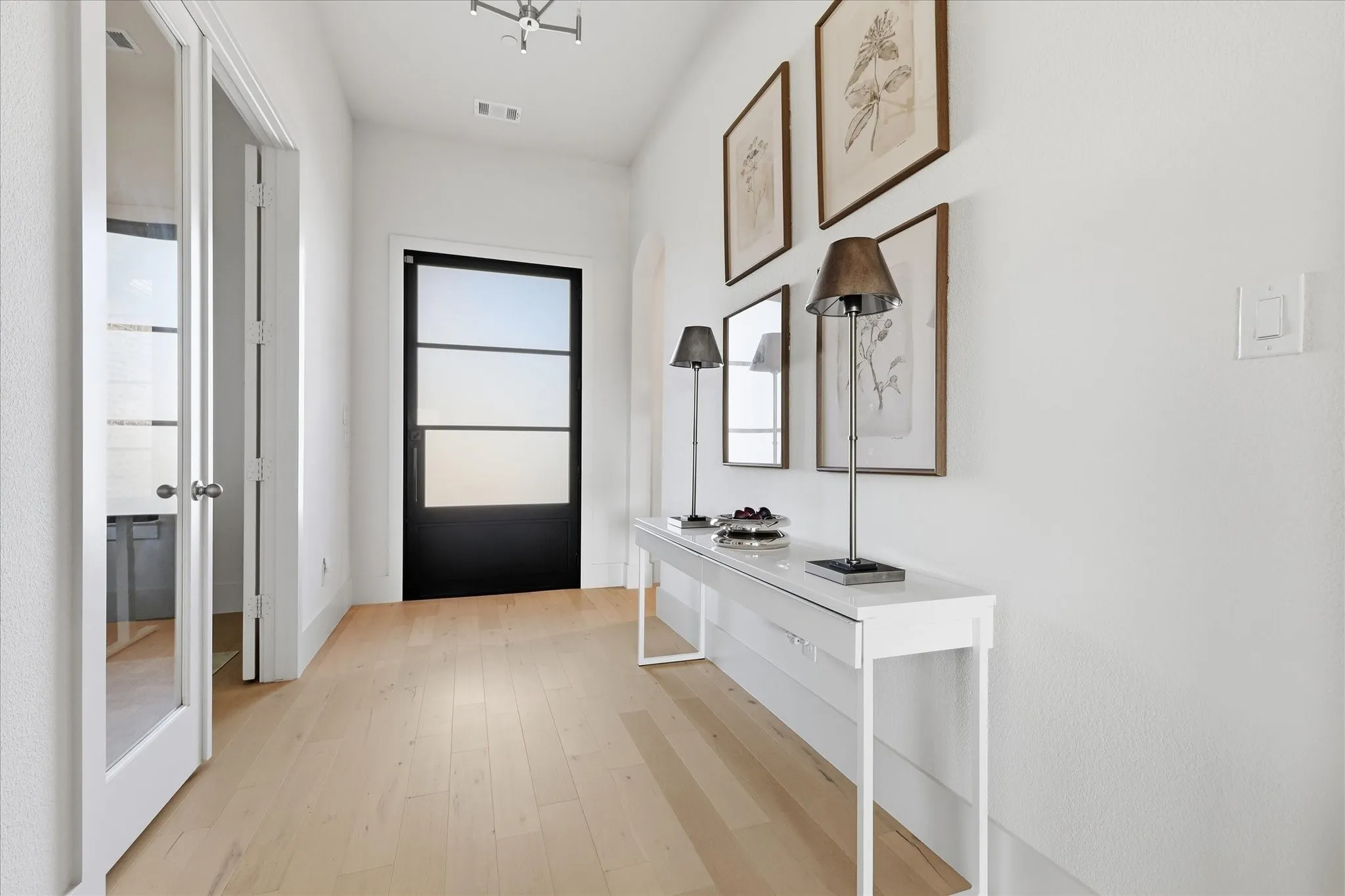 Airy foyer creates a seemless transtion from outside