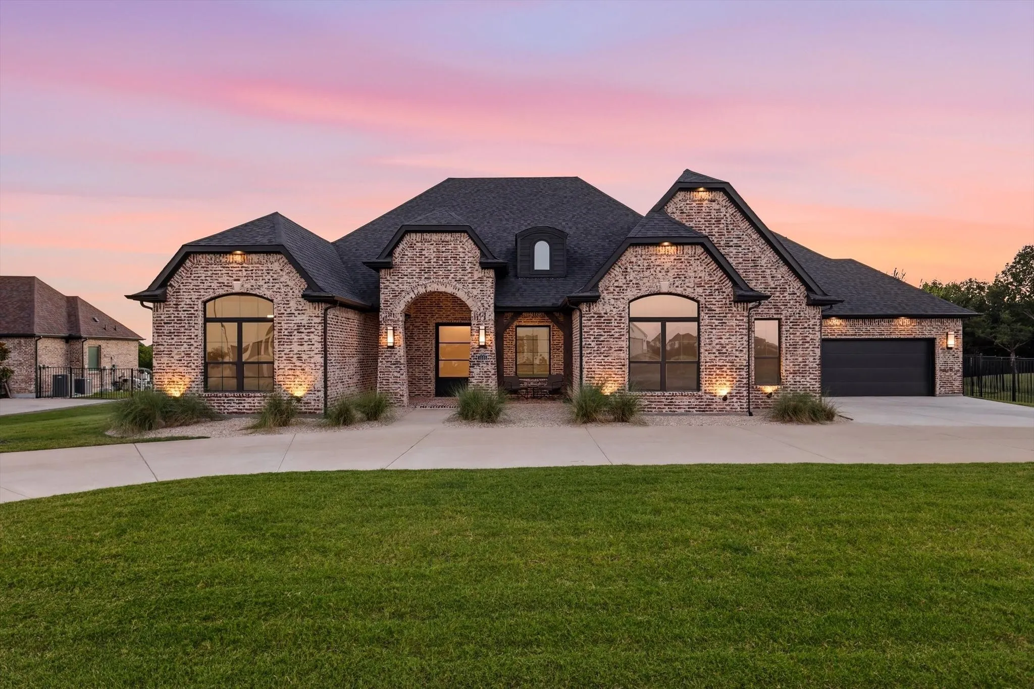 Beautiful wifi controlled exterior up lighting on this 2024 Partners in Building Custom home.