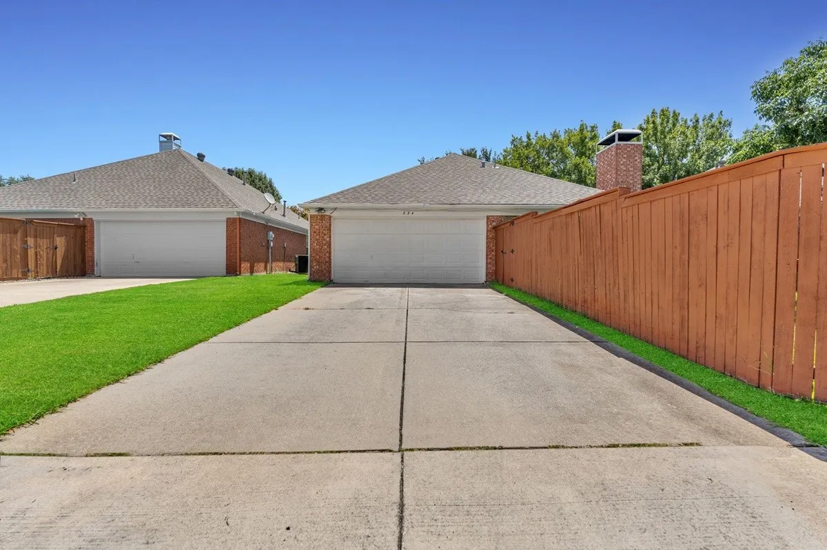 Concrete driveway providing direct access to the two-car garage