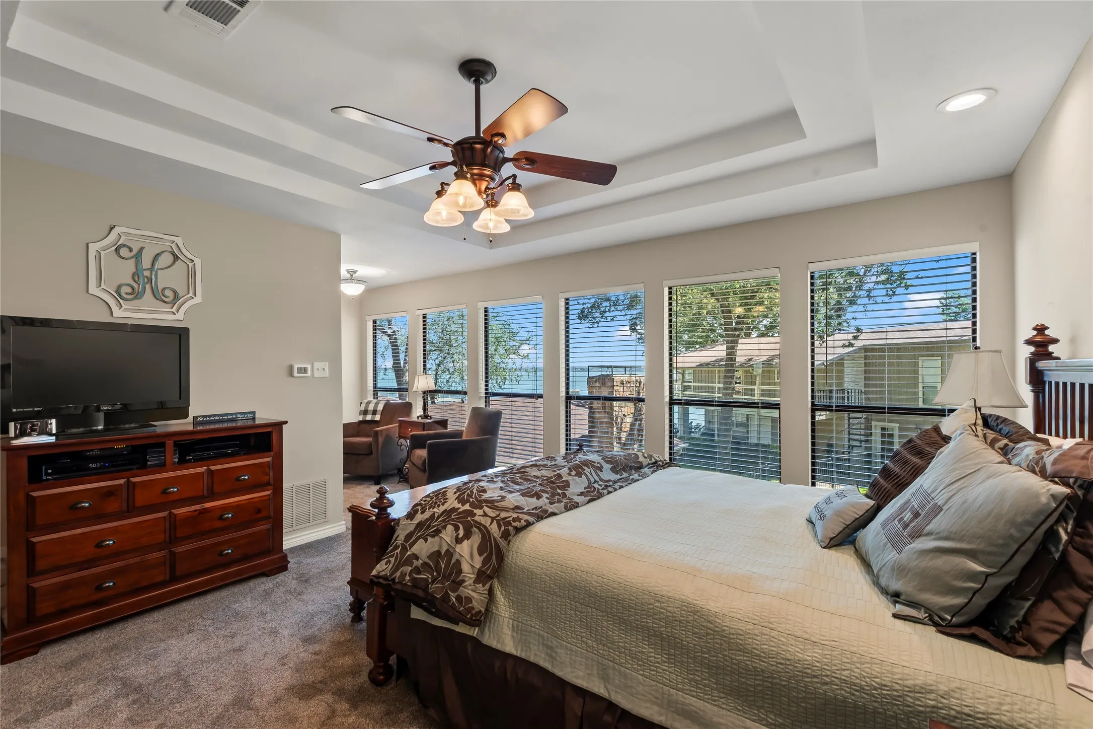 Primary bedroom with beautiful lake views.