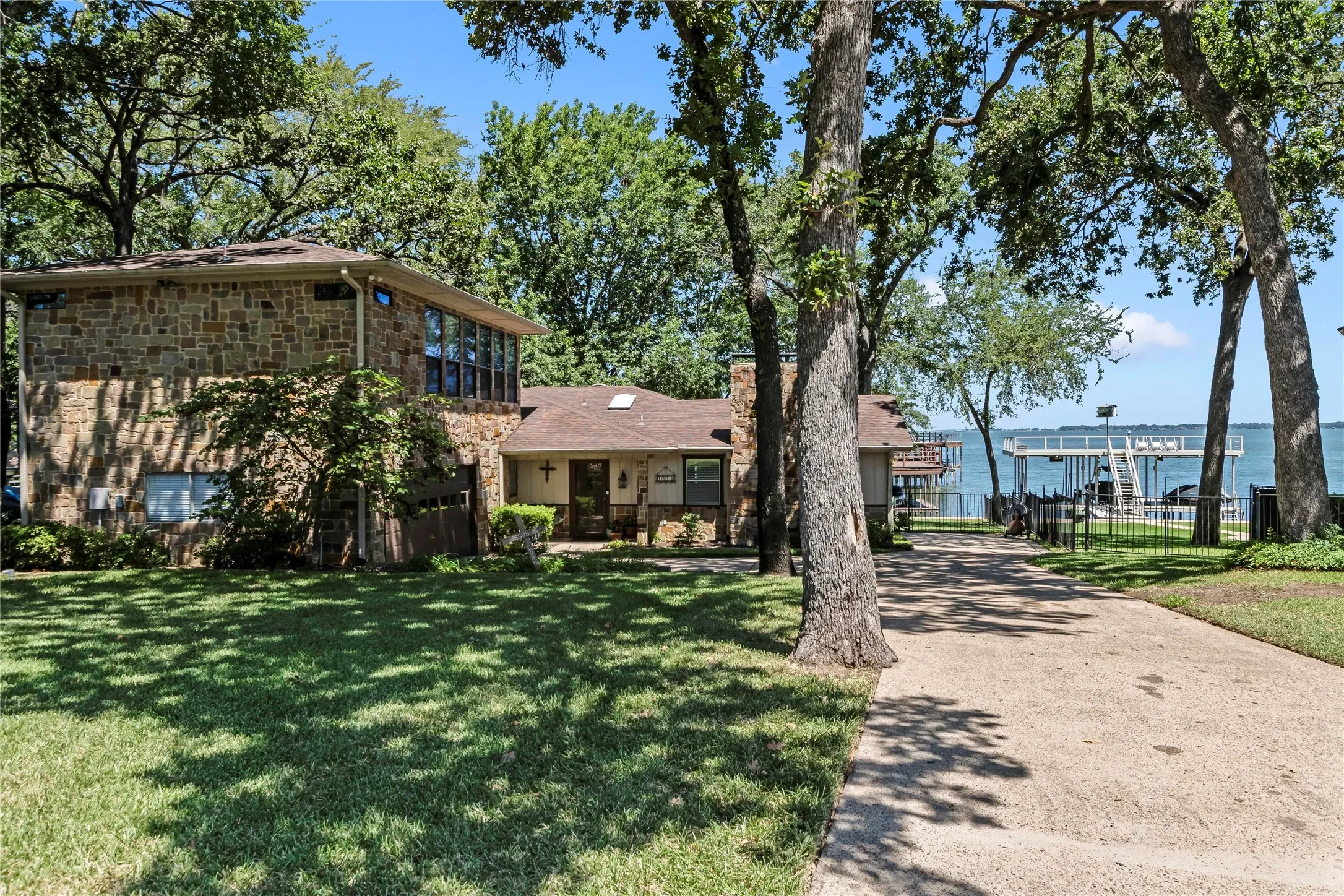 Inviting front entry with mature landscaping and welcoming curb appeal.