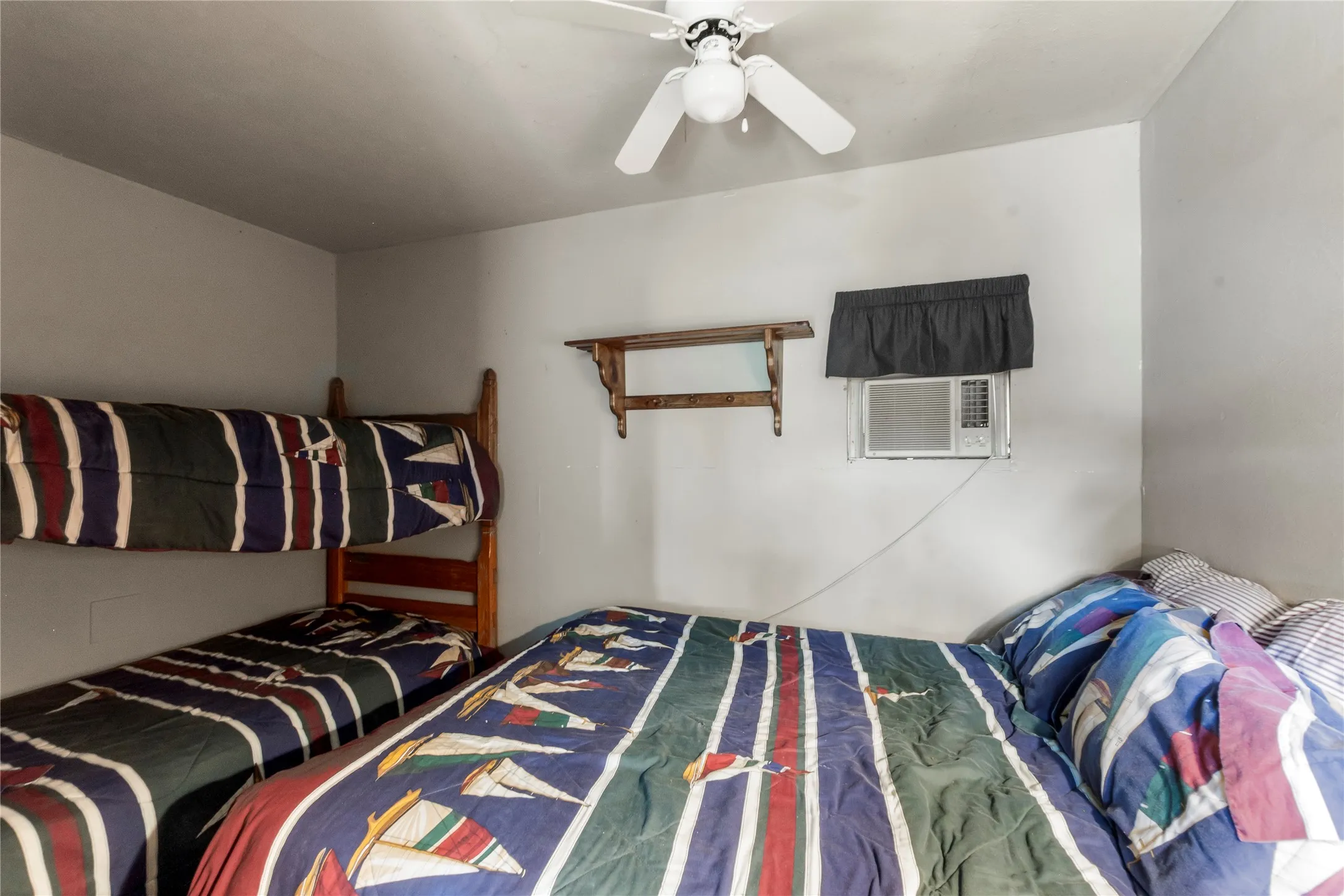 Detached guest quarters additional view showing the bunk bed and twin size bed.