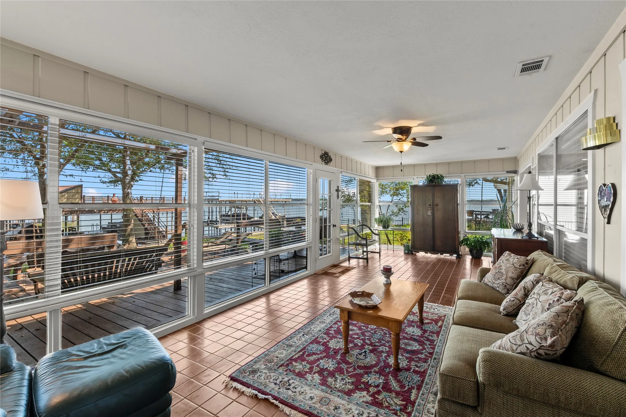 Glassed enclosed sunroom overlooking the lake