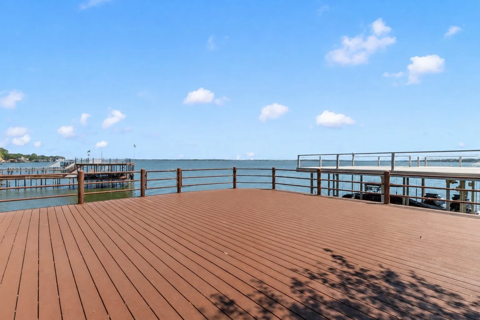 Party deck with low maintenance composite decking and large storage room.