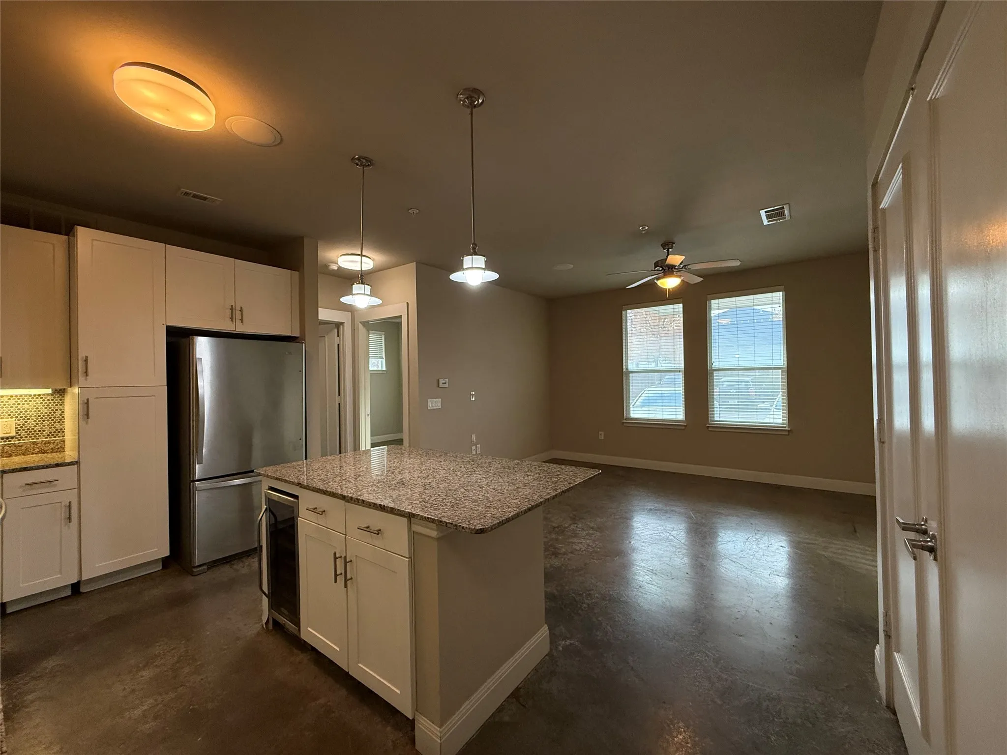 Kitchen island with granite countertop and integrated beverage cooler