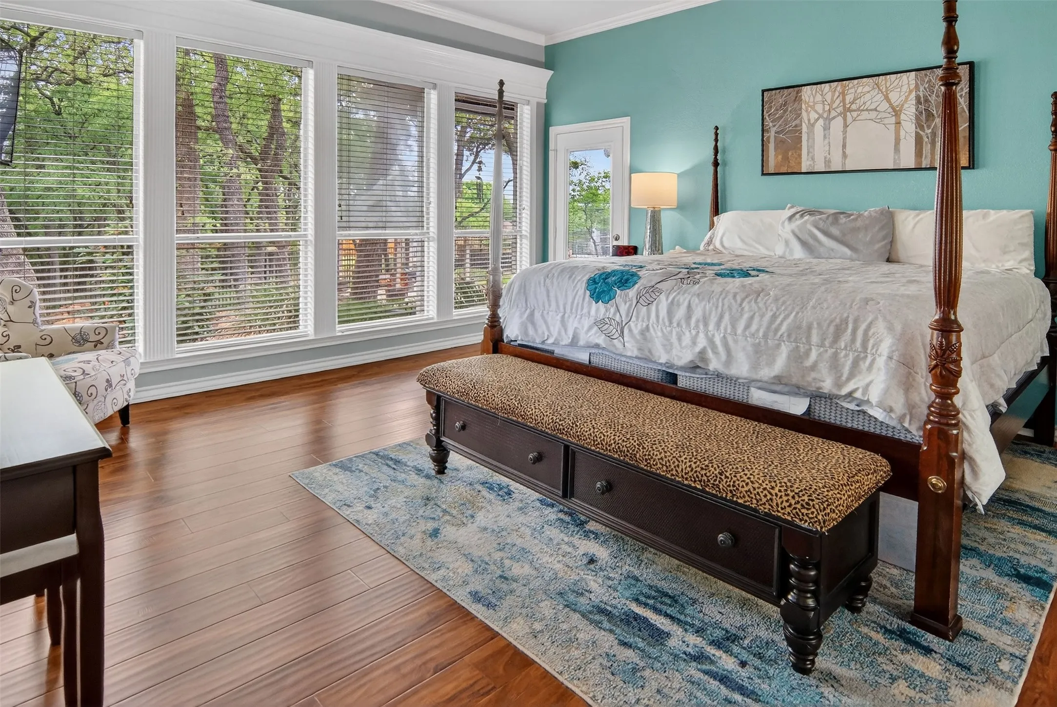 Wake up to a view of the lovely backyard through the wall of beautifully framed windows.