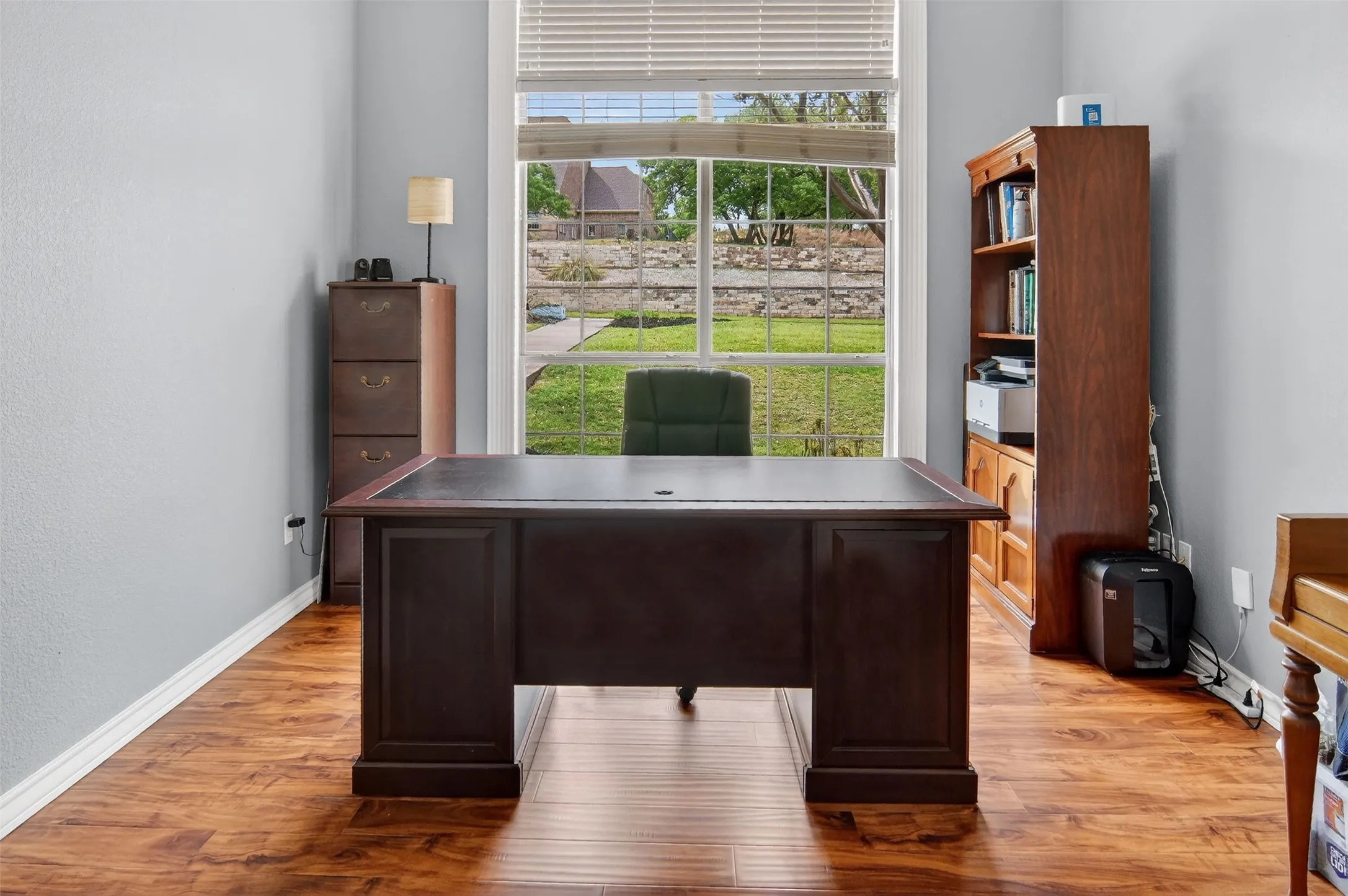 Spacious office with french doors for privacy.