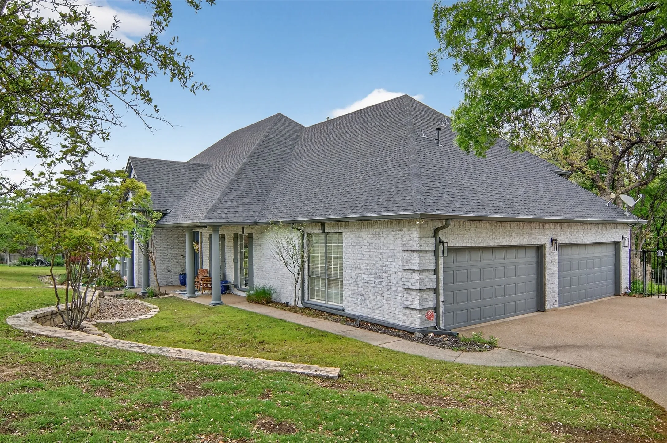 Behind the two large garage doors is an over-sized three-car garage with a workbench and storm shelter.