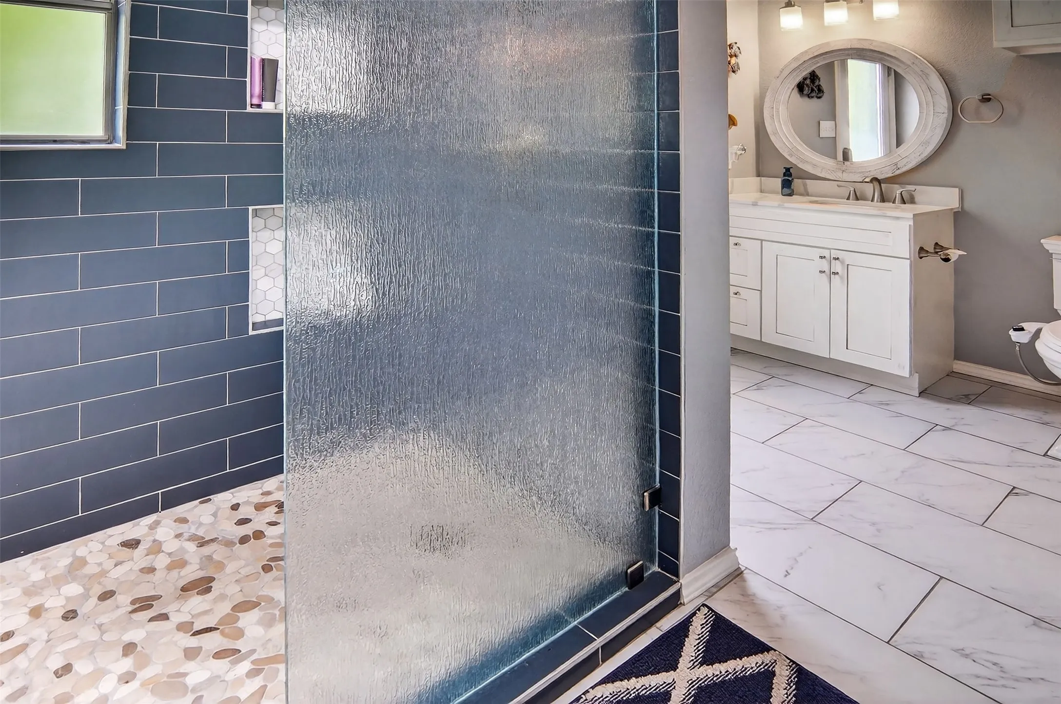 Full bathroom accessible from backyard and pool area.