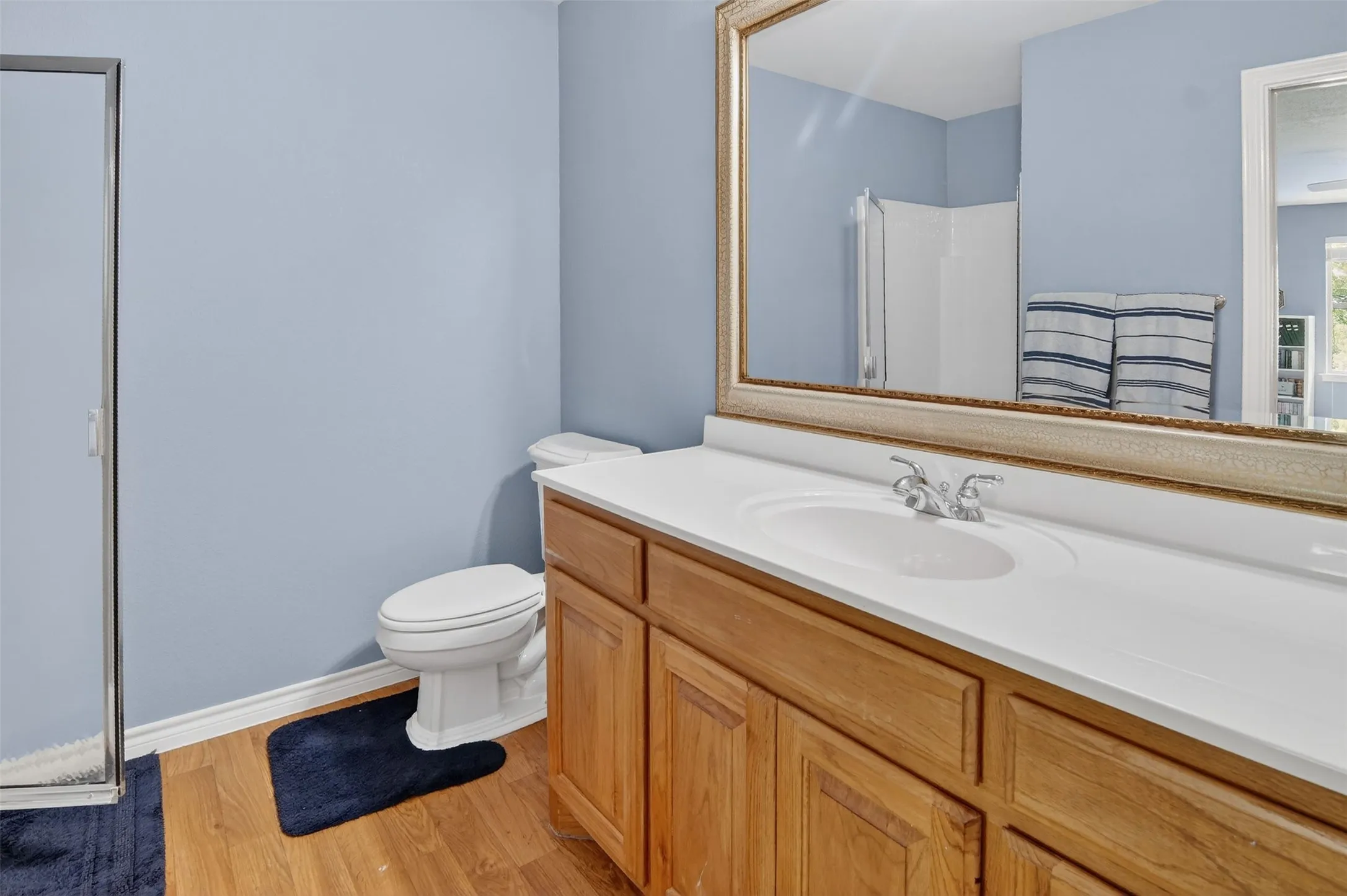 Upstairs full bath with walk-in shower off the game room.