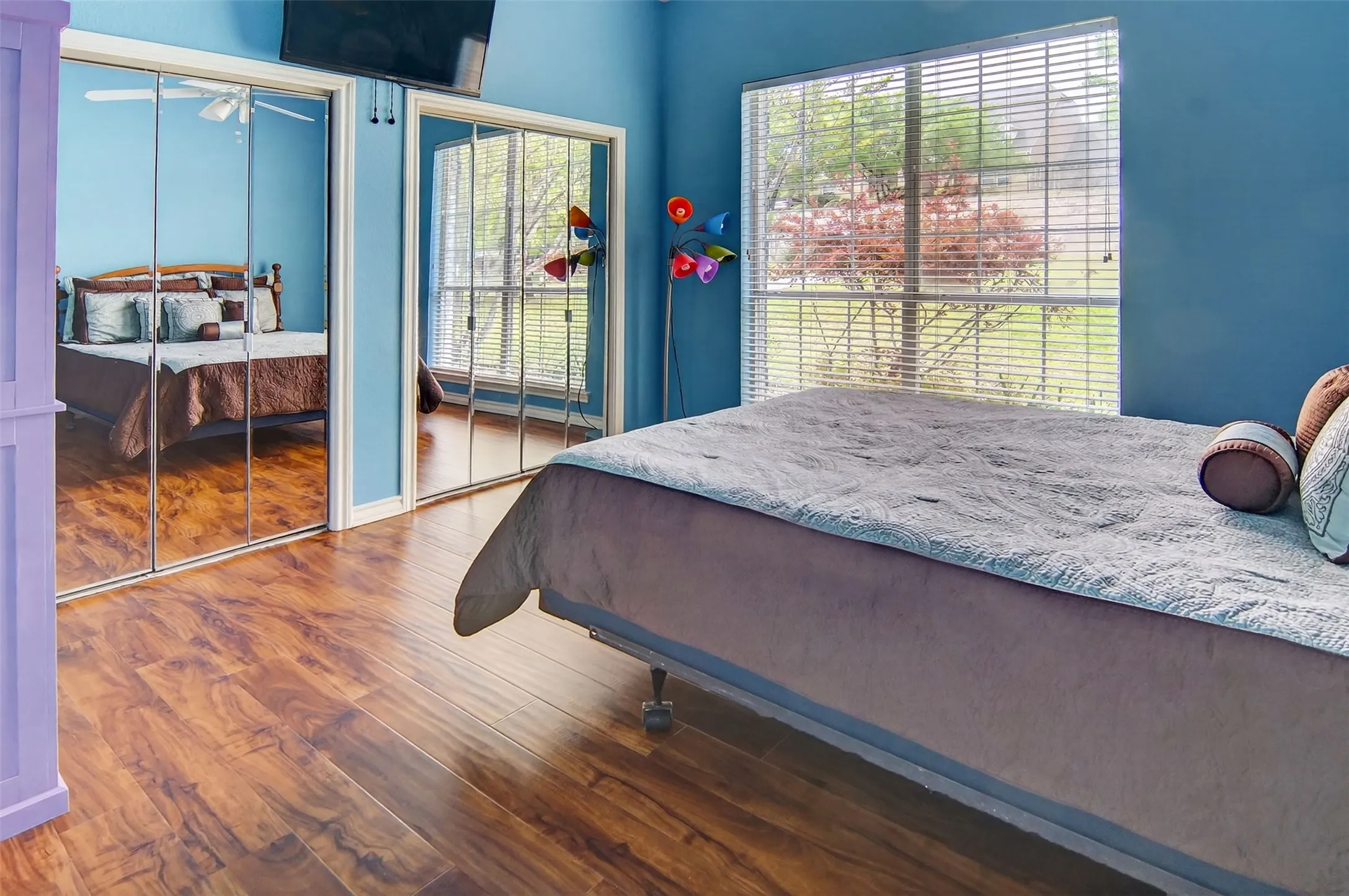 Another spacious bedroom with ample closet space and large window.